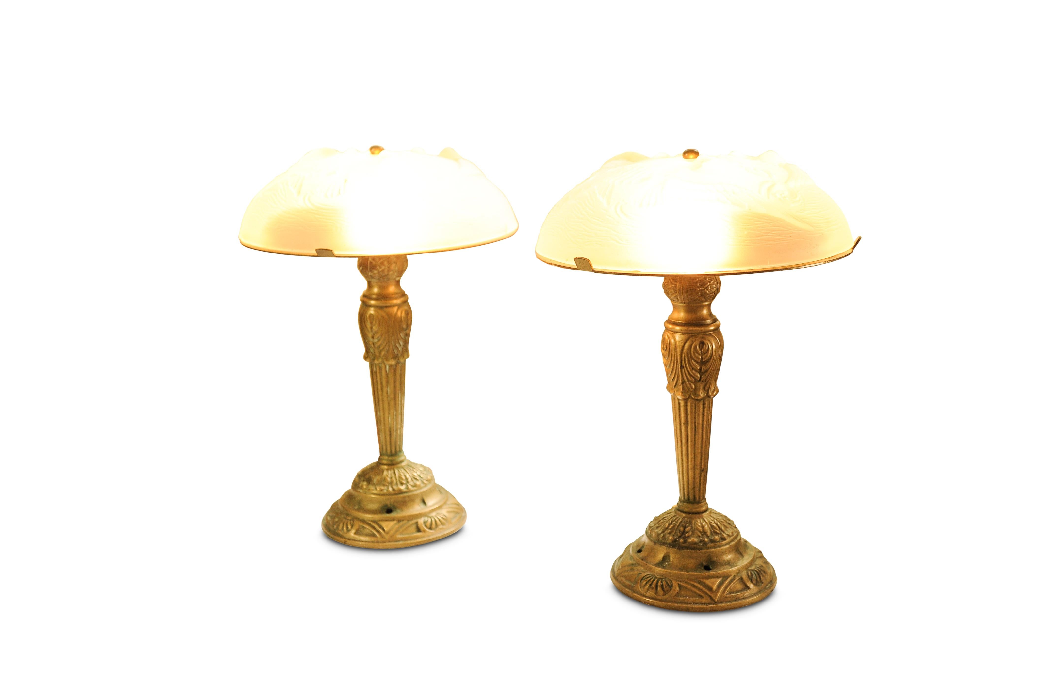 A Pair of French Art Deco Highly Decorative Brass & Glass Table Lamps In The Manner of Léon Hugue and Rene Lalique

Léon Hugue was a producer of art deco lighting in Paris during the Art Deco period. He often used Degué-made shades for his