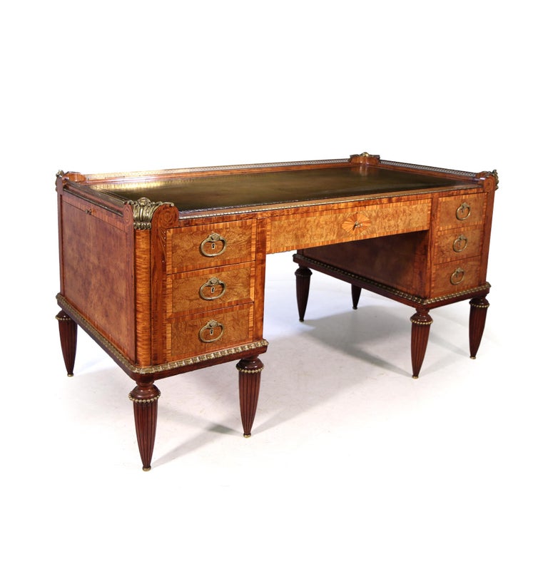 French Art Deco desk by Dufrene

A very early Museum quality Art Deco desk designed by Maurice Dufrene, c1910-1920 produced in solid oak and use of exotic veneers such as Amboyna, Tulip wood and burr Elm. There is very delicate inlay to all the