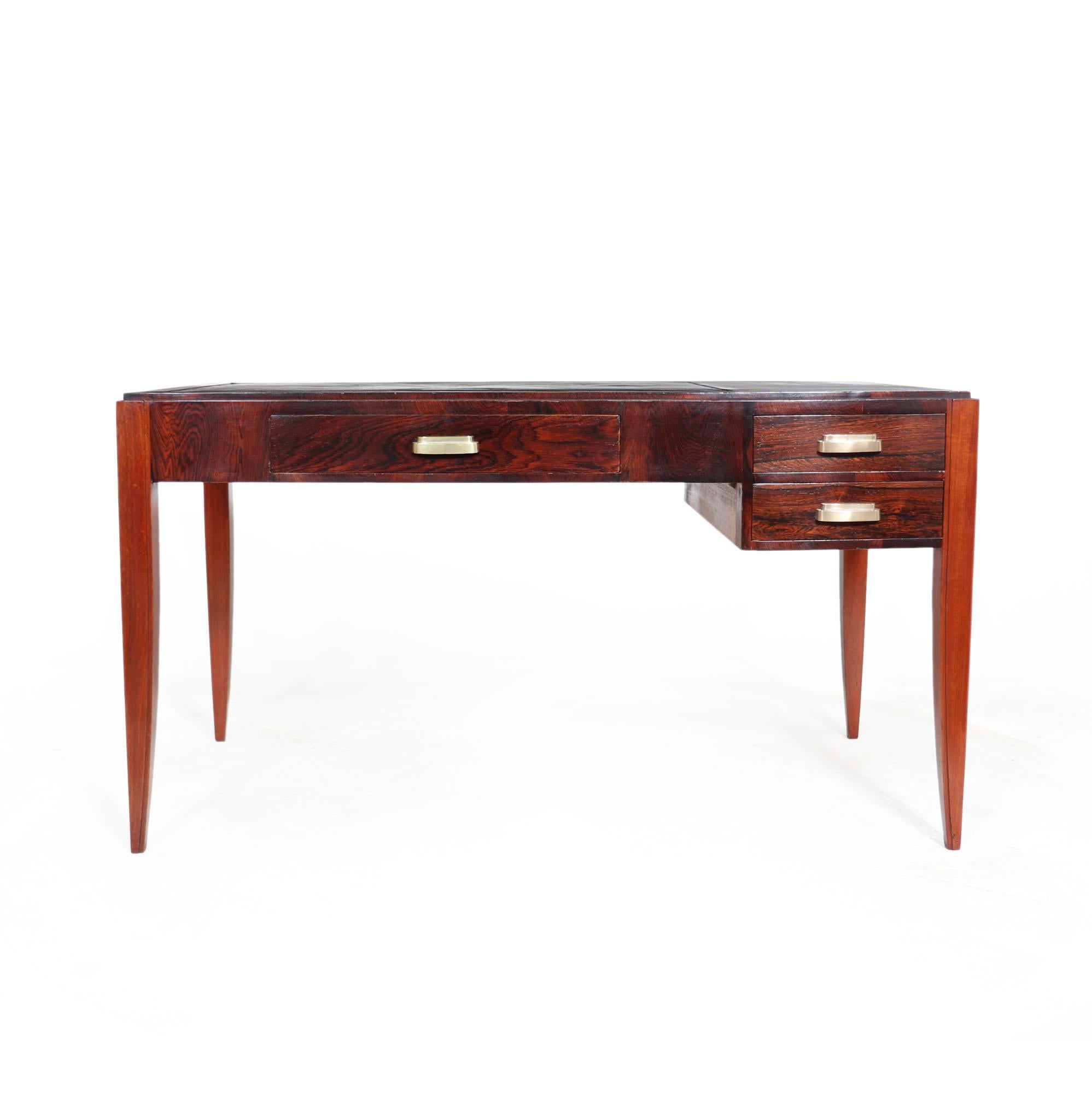 FRENCH ART DECO DESK
A great quality writing desk produced in France in the 1920s in rosewood with original leather that has later been blackened, solid oak frame and it has three drawers with lovely brass cup handles and sabre legs, the desk is in