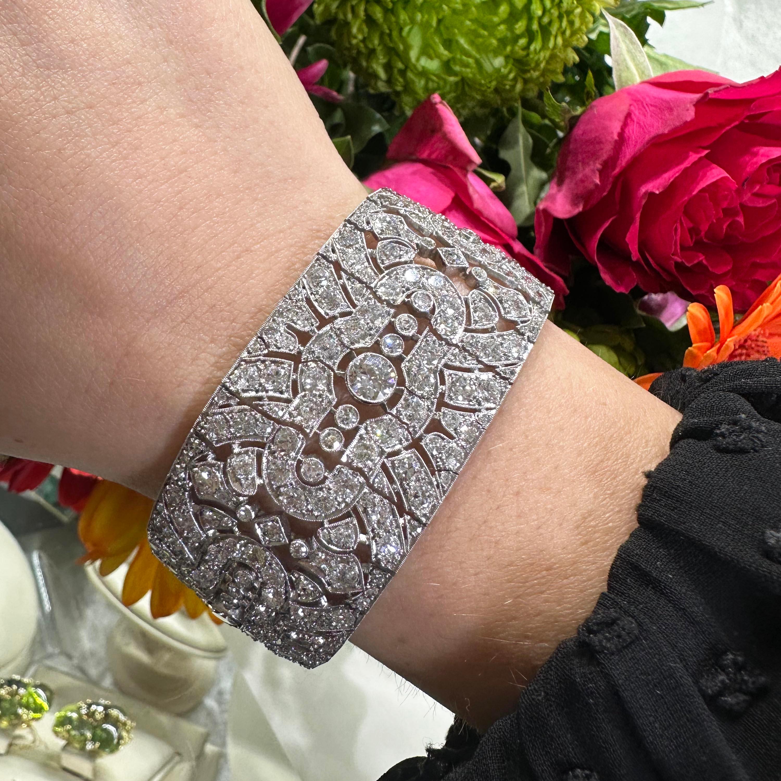 A French diamond and platinum Art Deco bracelet, with a diamond set repeating openwork pattern of five motifs, with an Edwardian-cut diamond set in the centre of each motif, with three Edwardian or eight-cut diamonds either side, in rub over