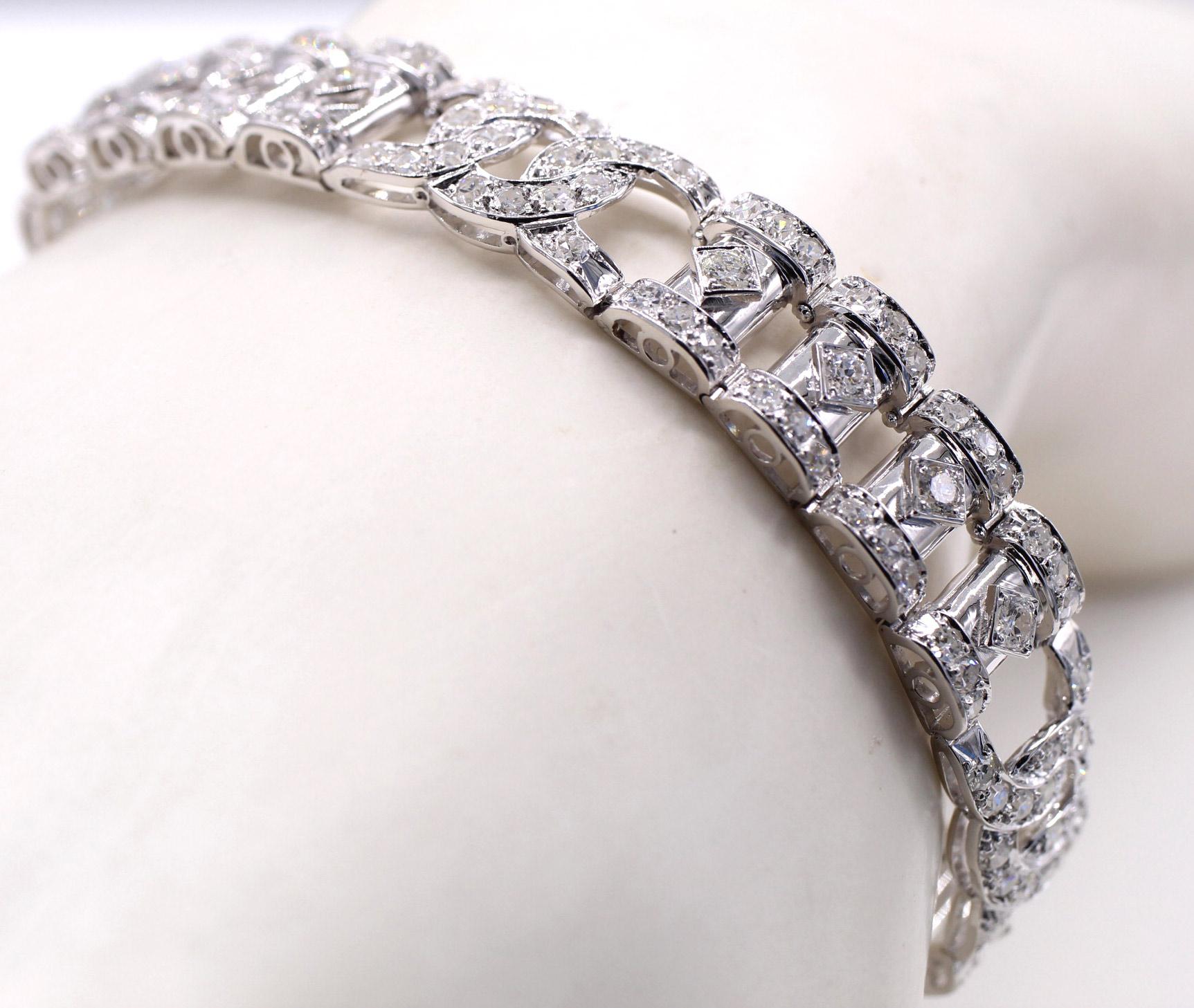 Beautifully designed and handcrafted in 18 karat white gold this flexible link Art Deco French bracelet from ca 1930 is set with lively white bright old cut round diamonds. Length 7 7/8 inches in length. French hallmarks and markers mark.
