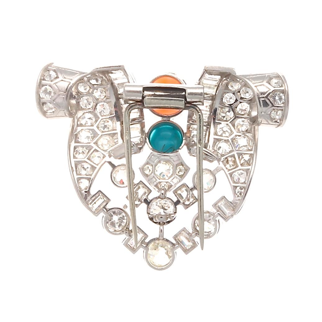 Quintessential Art Deco design featuring the fundamentals of what made this period so glamorous; abstract symmetry of geometric shapes. Featuring an array of old European cut diamonds as well as baguette and emerald cut diamonds perfectly placed to