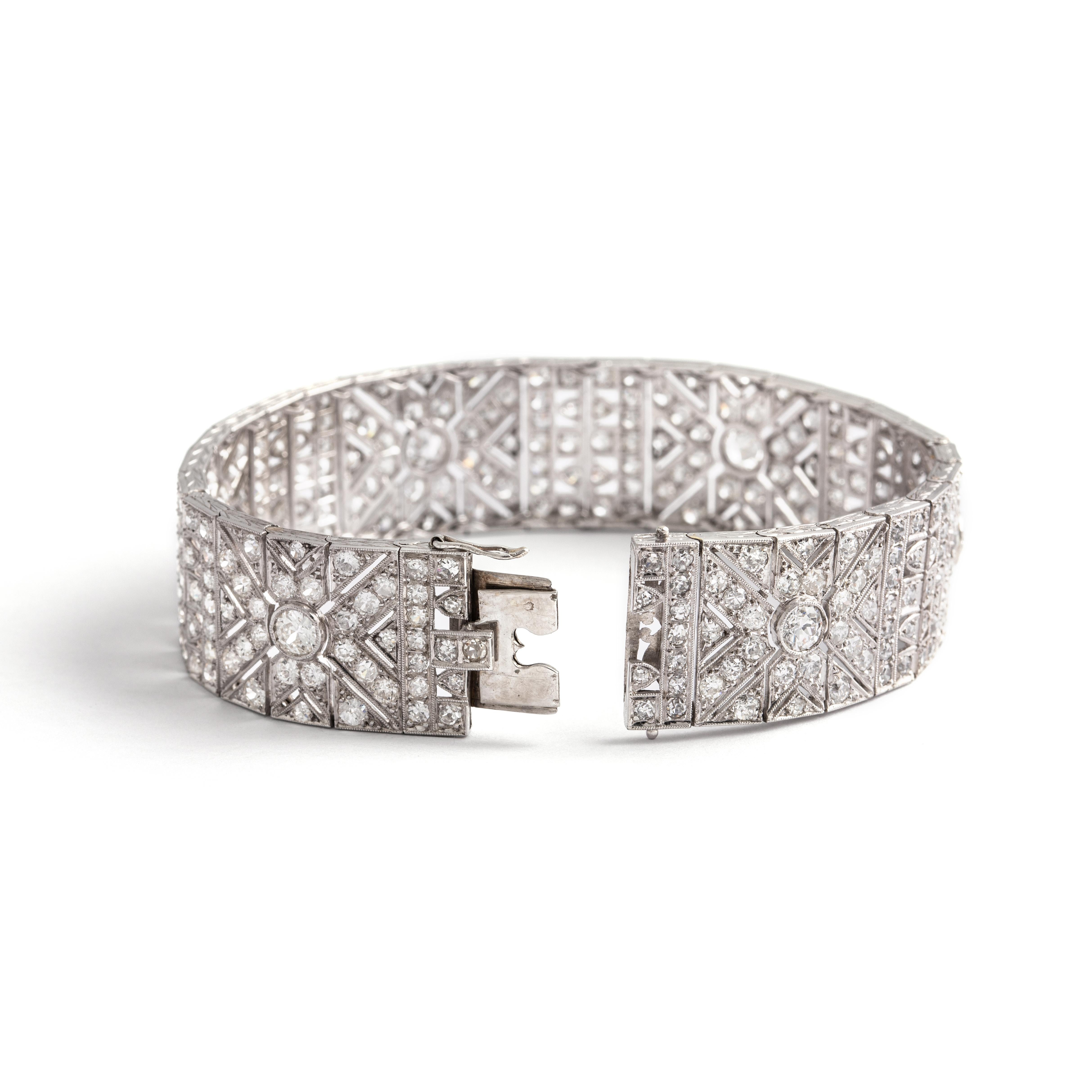 French Art Deco Diamond Platinum Bracelet.
French assay mark. Early 20th Century.

Length: 18.40 centimeters.
Width: 1.70 centimeters.
Gross Weight: 42.46 grams.
