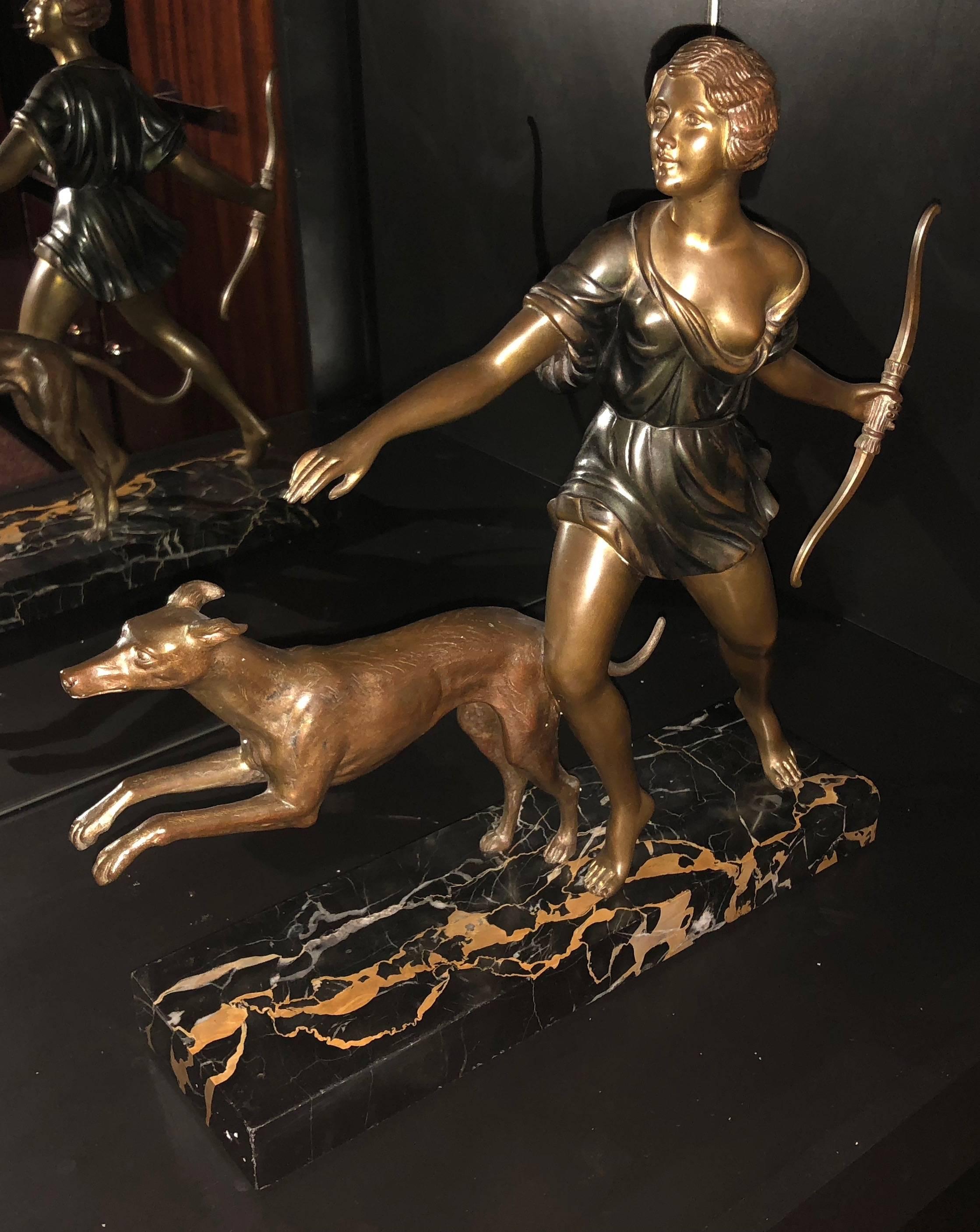 Art Deco Figure of Diana The Huntress by Inacio Gallo. This sculpture is in bronze and sits on a multicolored portoro marble base. Signed I Gallo to rear edge of marble. Classic Diana figure with subtle cold painted bronze treatment giving the