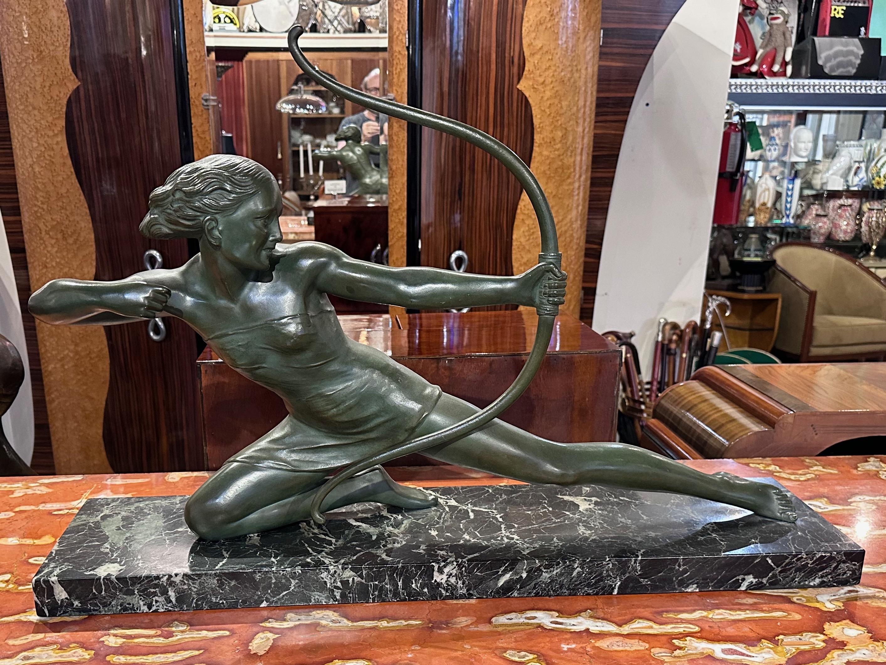 French Art Deco Diana the Huntress Bronze by S. Melanie 1930s, crafted in the 1930s, stands as a testament to the artistic brilliance of the era. This extraordinary sculpture exudes a commanding presence through its size, weight, and the dynamic