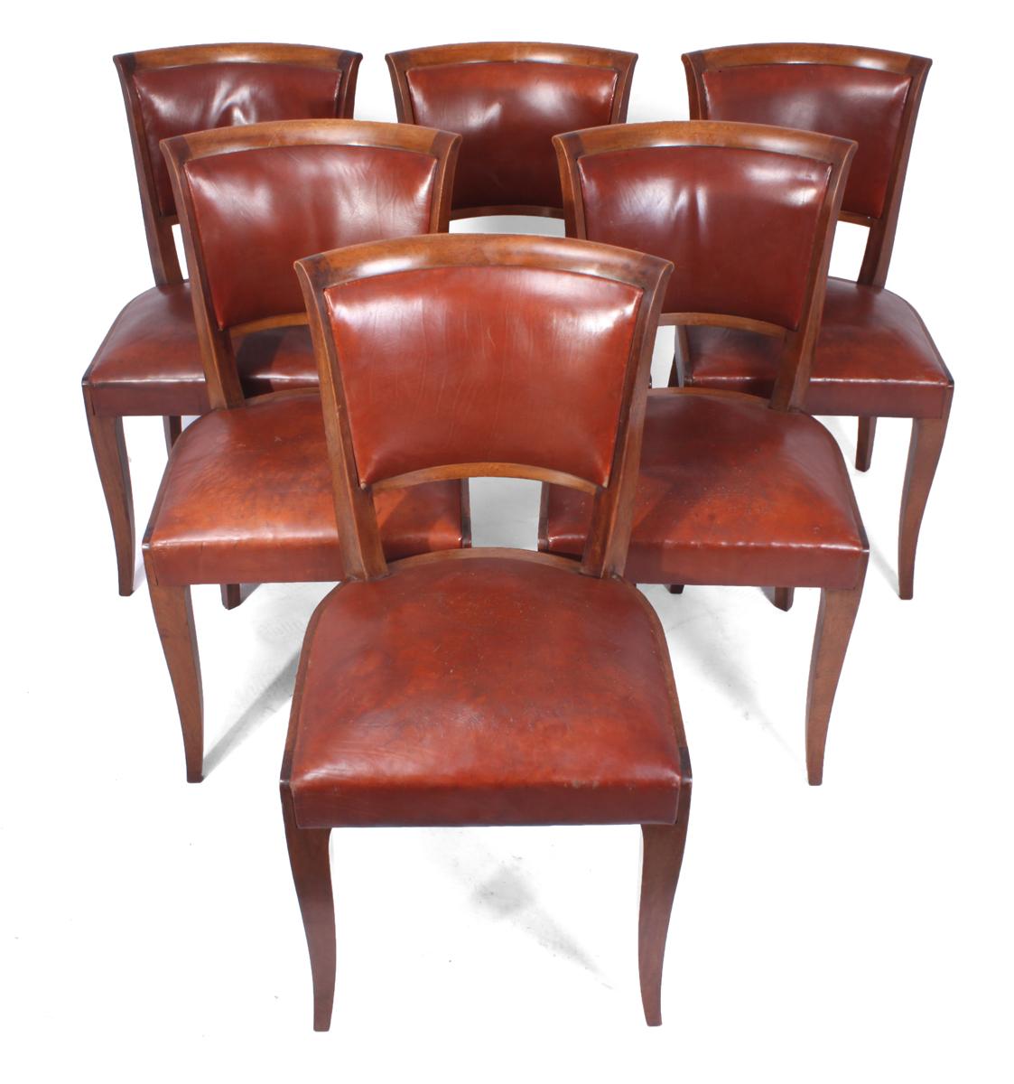 French Art Deco dining chairs, circa 1930

A set of 6 solid mahogany dining chairs with original leather upholstery in original condition, the chairs have good art deco Parisian style with sweeping back legs, the chairs are solid with no loose