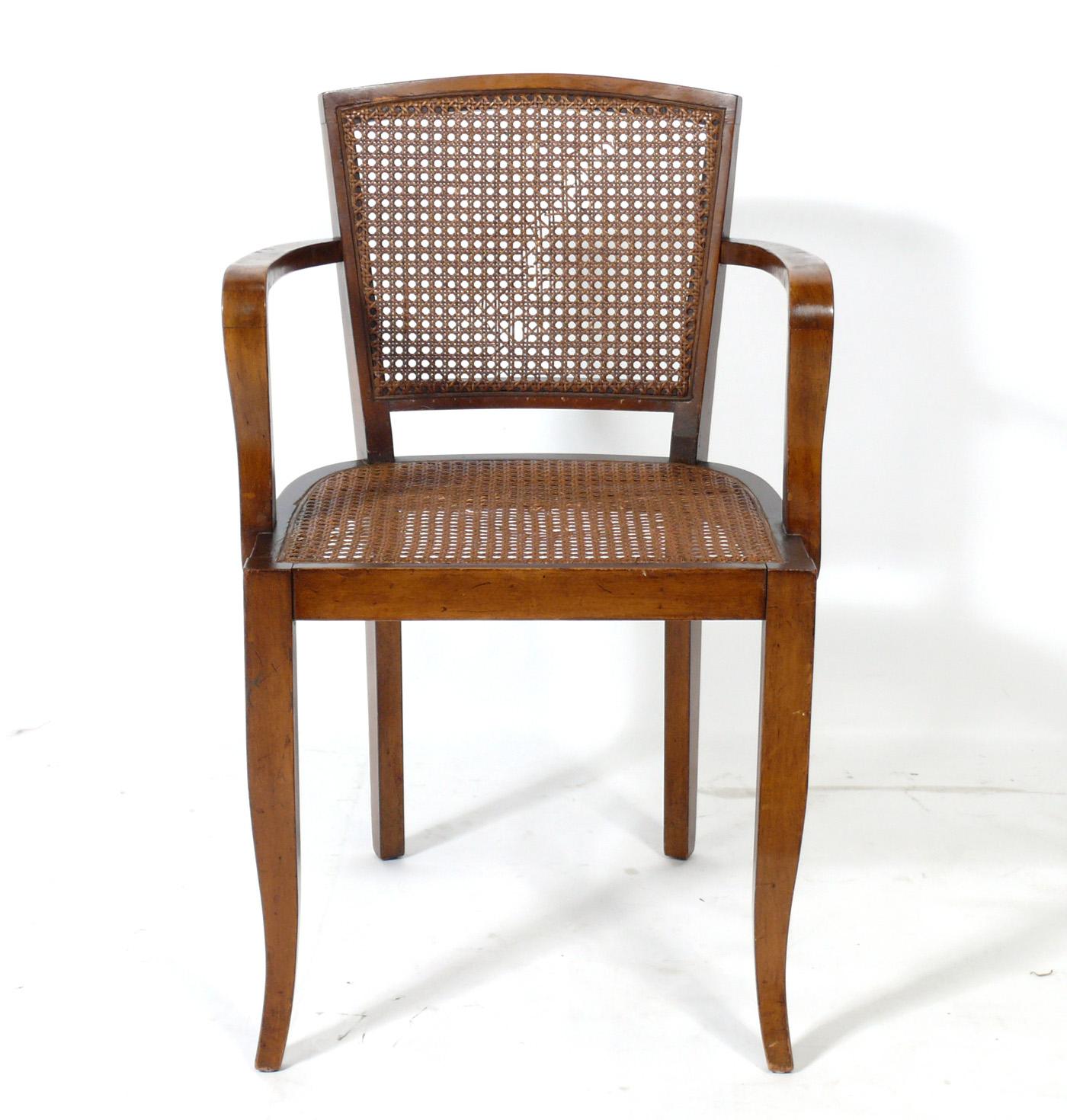French Art Deco dining chairs, France, circa 1930s. These chairs are currently being completely restored and can be completed in your choice of finish color. We can re-do the cane, or reupholster them in your fabric for no additional charge. The