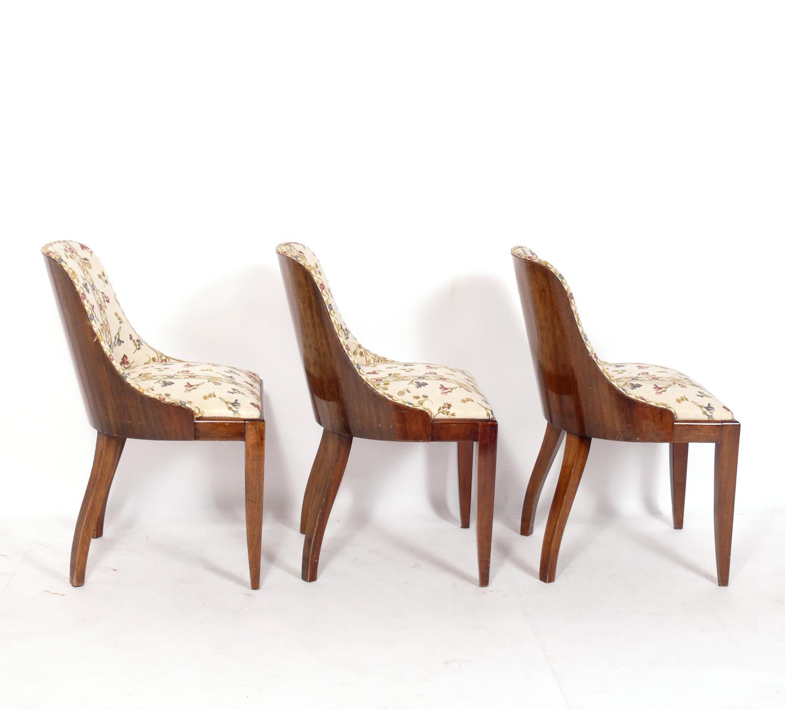 Set of six Curvaceous French Art Deco dining chairs, in the manner of Emile Jacques Ruhlmann, France, circa 1930s. These chairs are currently being refinished and reupholstered and can be completed in your choice of wood finish color and