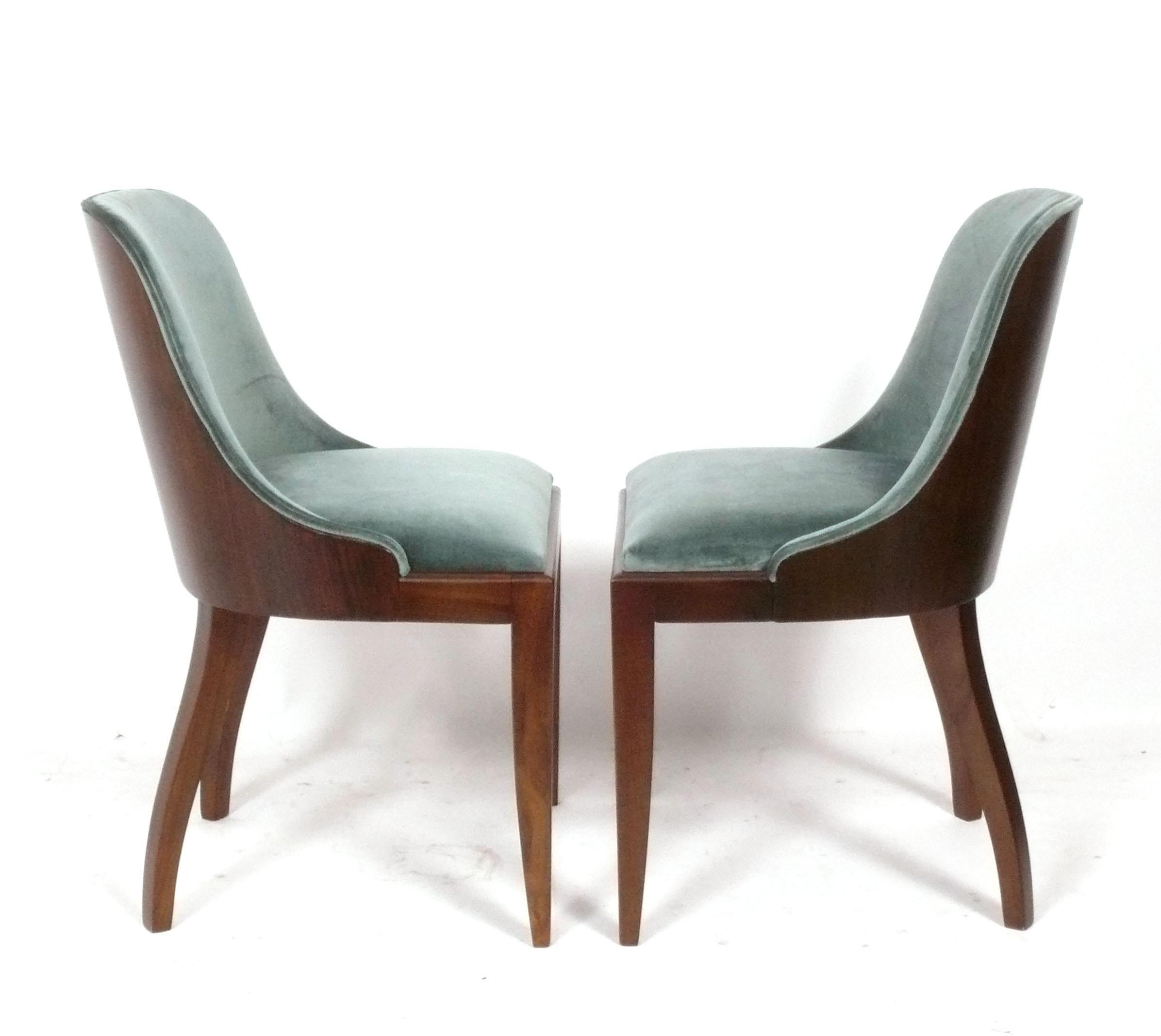 Set of Four Curvaceous French Art Deco Dining Chairs, in the manner of Emile Jacques Ruhlmann, France, circa 1930s. These chairs have been refinished at some point and reupholstered in Pierre Frey celadon green velvet.