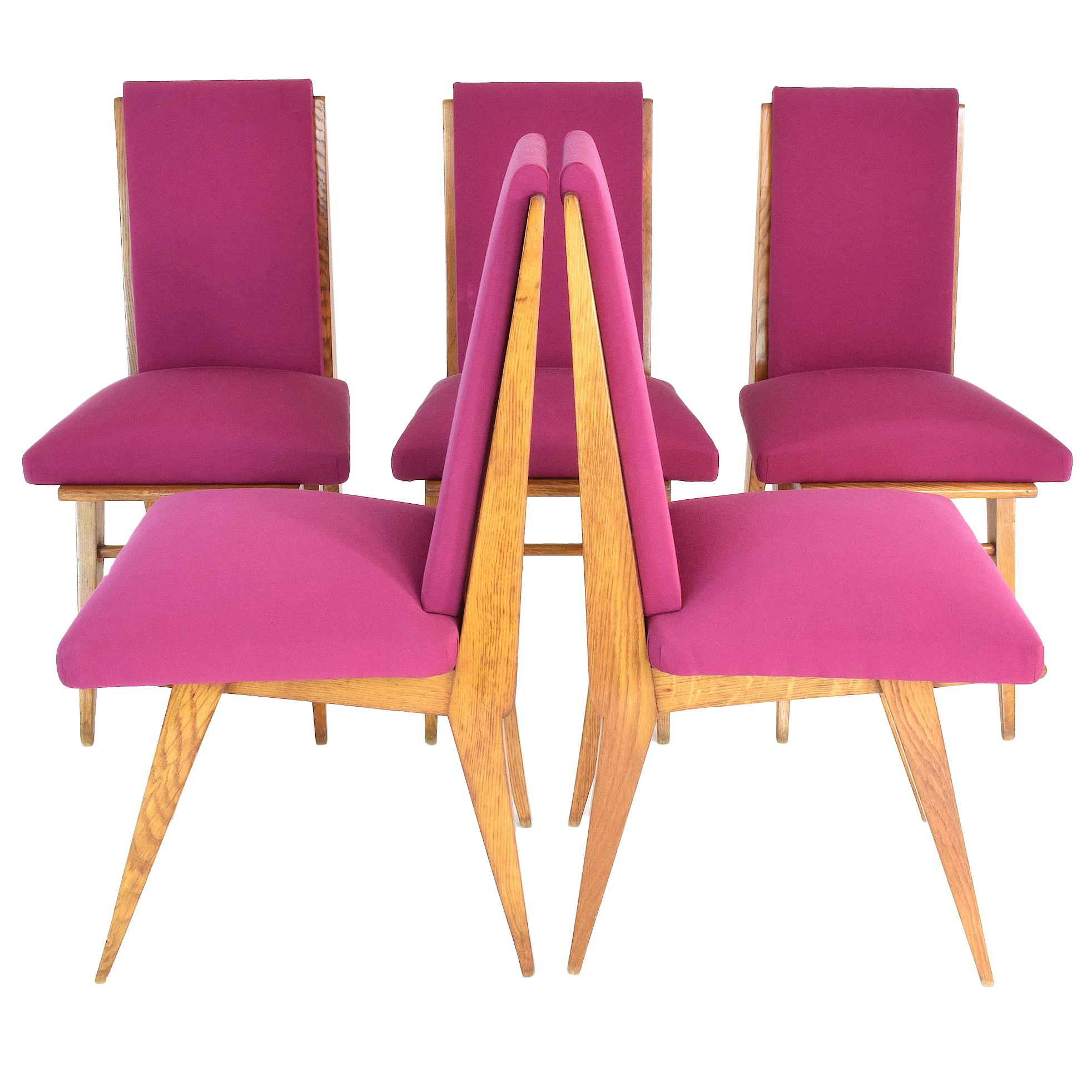 Stylish French 20th-century vintage high-back art deco dining chairs composed of solid oak and splayed,
tapered legs in the style of Charles Dudouyt. 
Entirely restored with a high-quality pink Lelievre Paris cotton fabric and re-finished