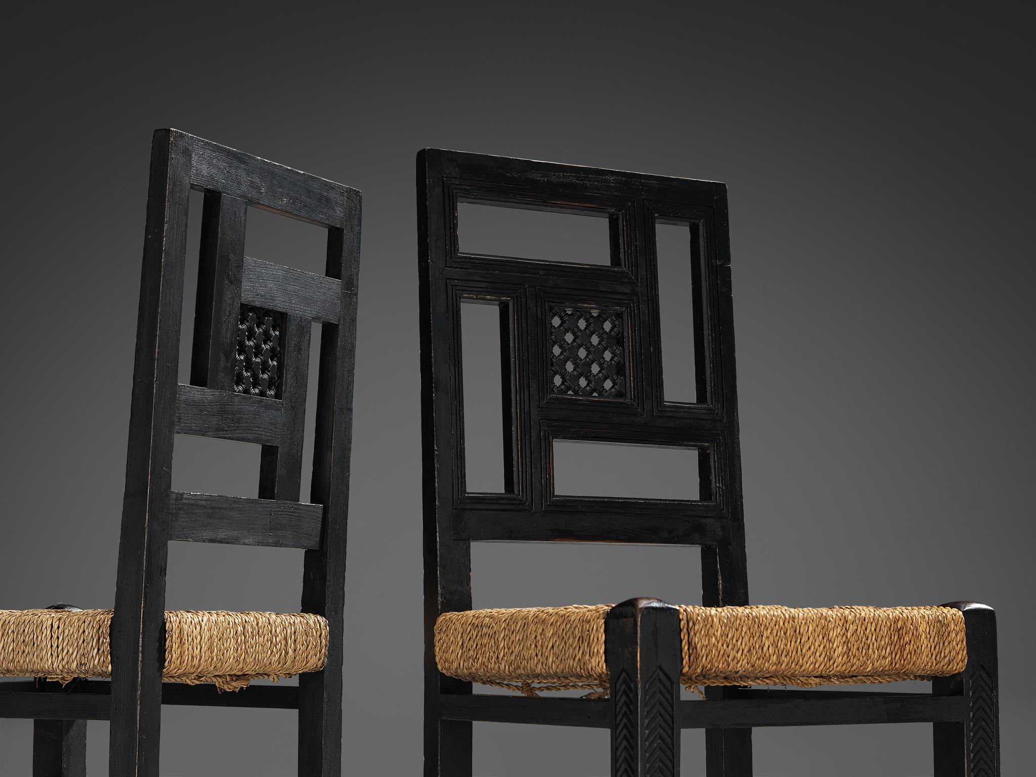 Pair of dining hairs, darkened pine, straw, France, 1930s

These lovely chairs made in France in the 1930s, display a charming and rustic elegance. These chairs have a strong character. Traditionally, with these type of rustic chairs, the fiber