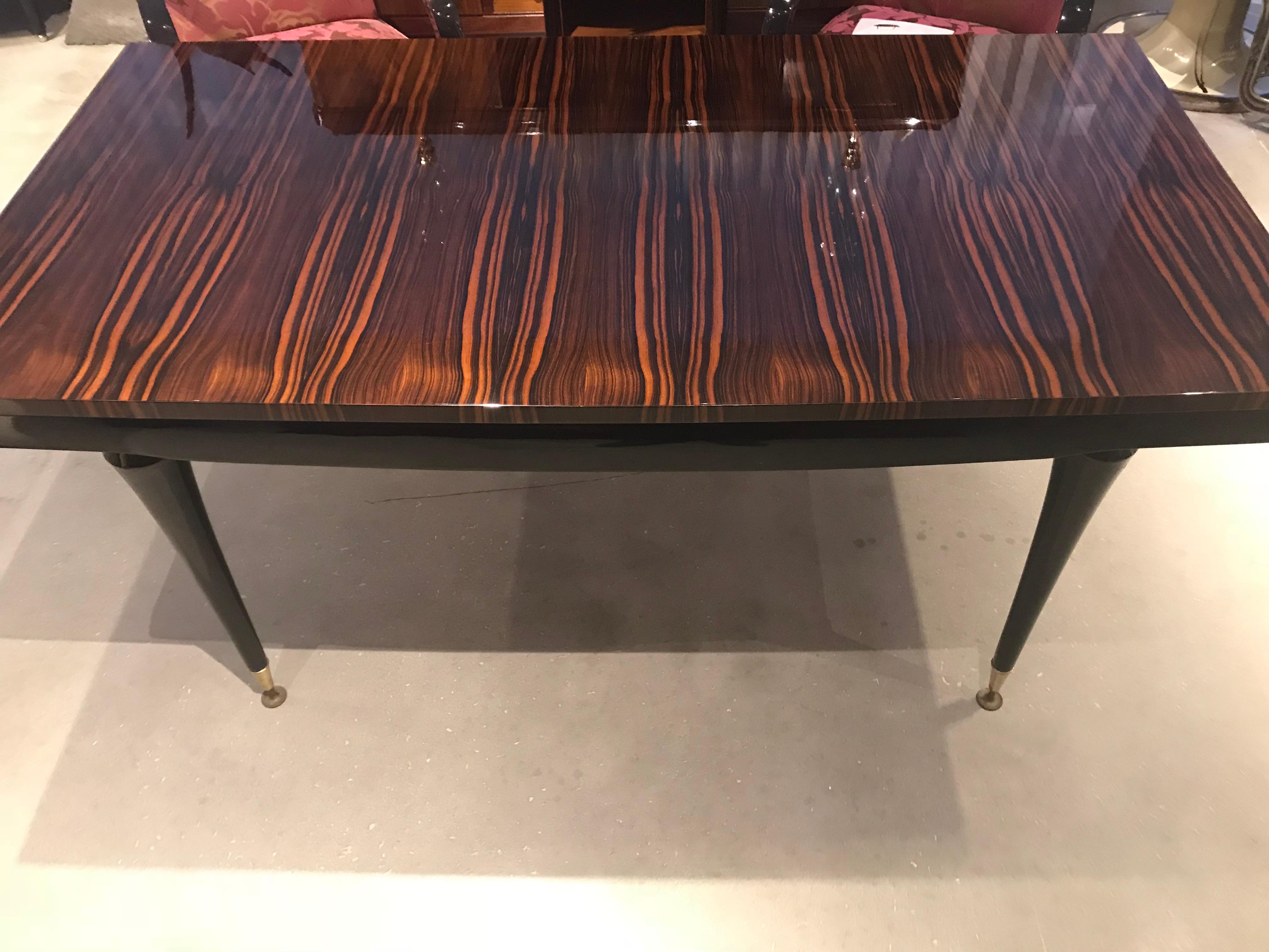 French Art Deco dining table made of macassar ebony with inlaid sycamore.