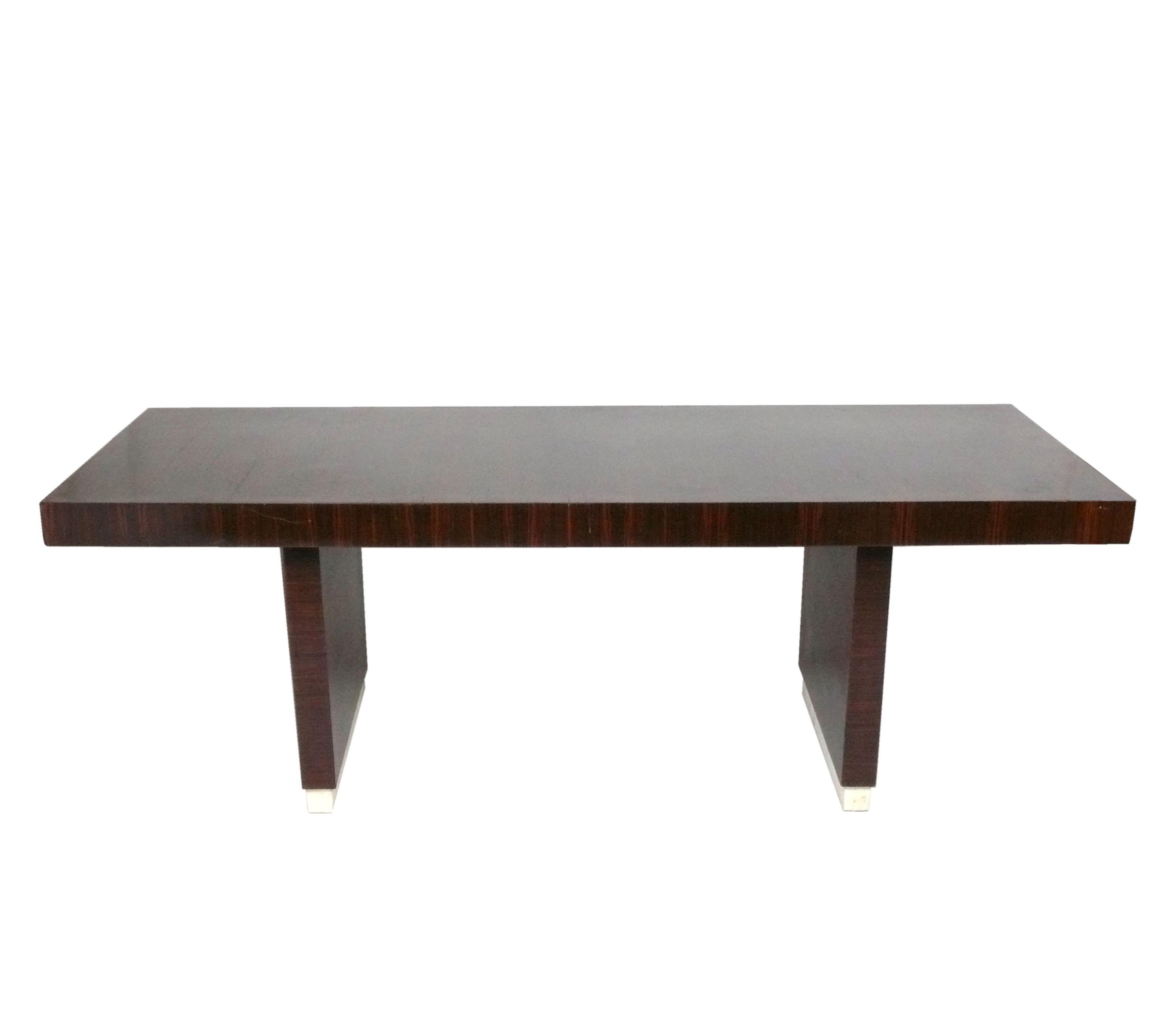 Elegant French Art Deco Dining Table, France, circa 1930s. This table is currently being refinished and will look amazing when completed. It has a clean lined design and is constructed of macassar ebony or rosewood. The height from the floor to the