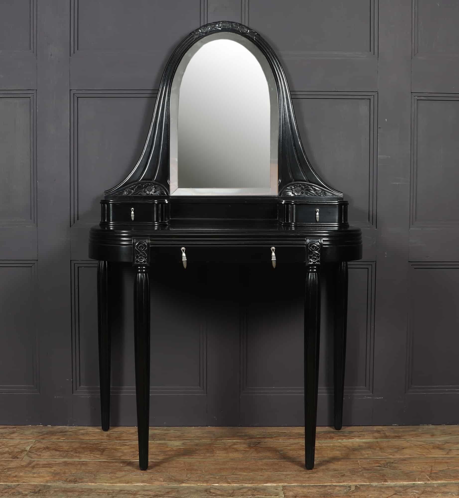 French Art Deco dressing table c1925
A stunning Art Deco dressing table produced in France in the mid 1920s from solid mahogany and ebonised with a piano black finish, the table has a central drawer with two table top drawers with very decorative