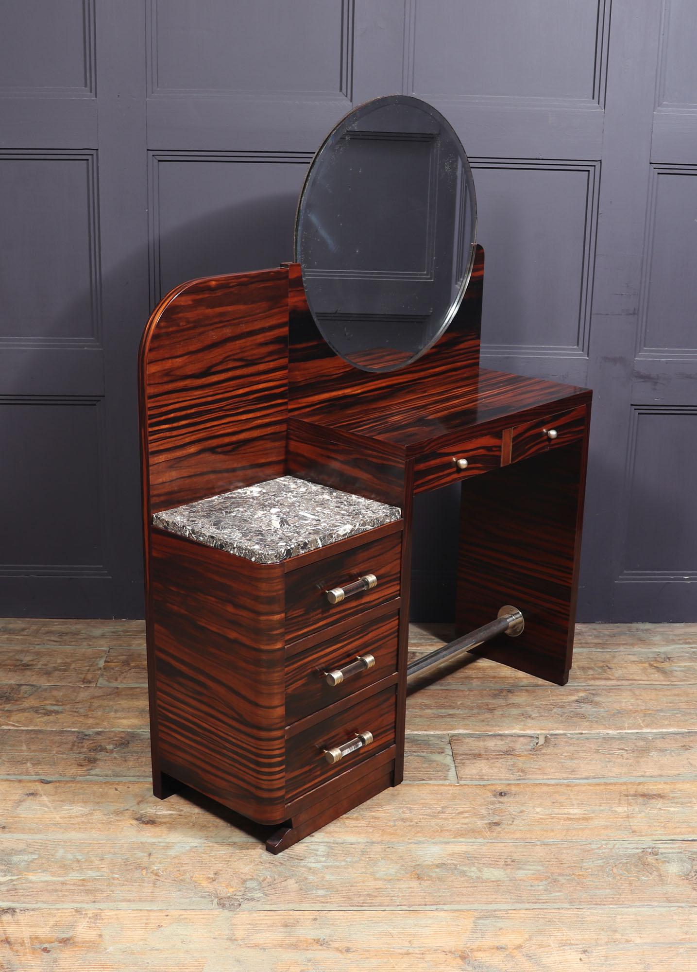 Art Deco dressing table
This Art Deco dressing table has three good sized lower drawers with glass cylinder handles on top of this has a marble top, above the seated area are two smaller drawers with brass pulls above is the original bevelled