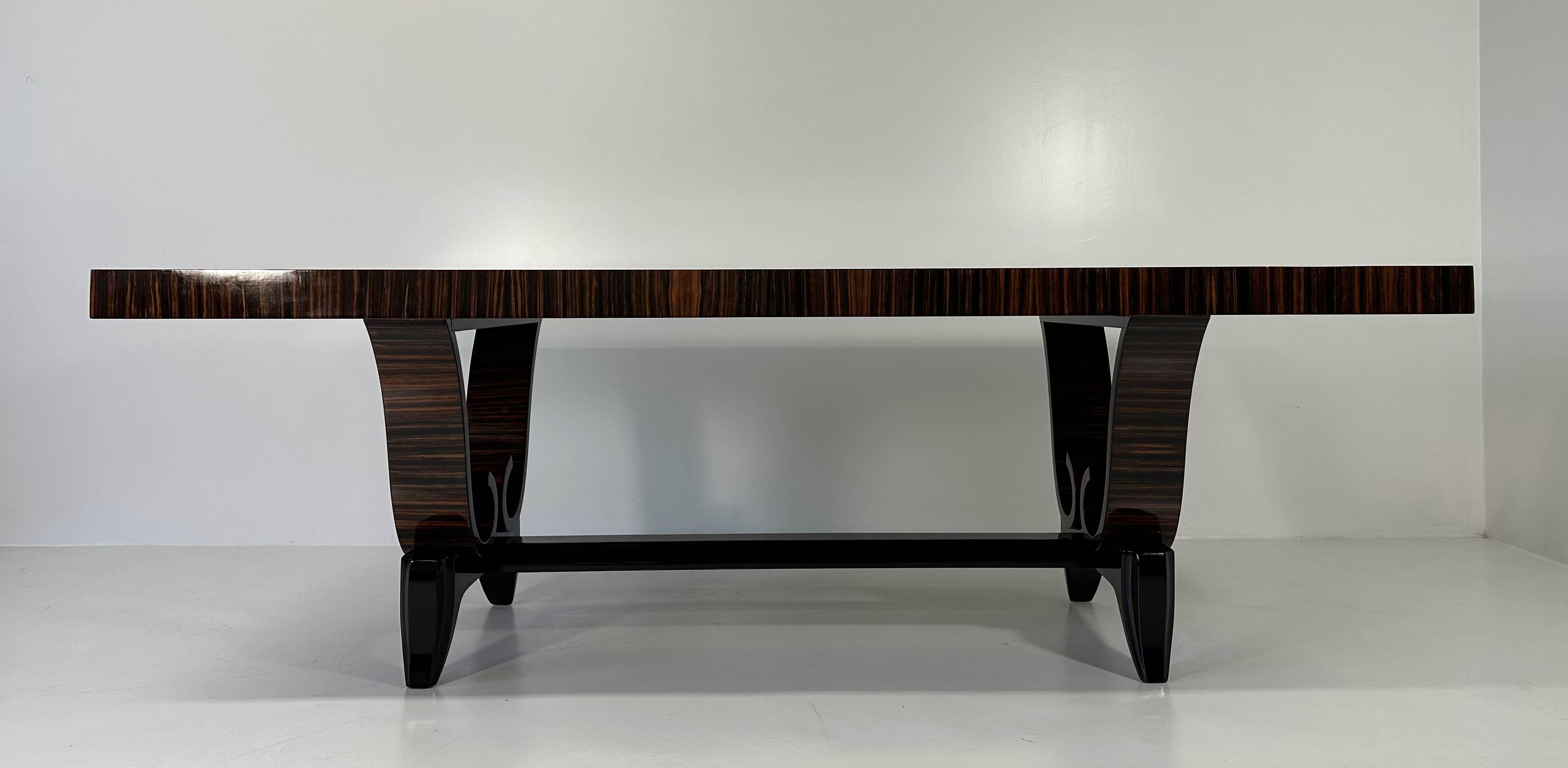 This Art Deco table was produced in France in the 1940s. 
It is completely made of Ebony and has black lacquered details.
