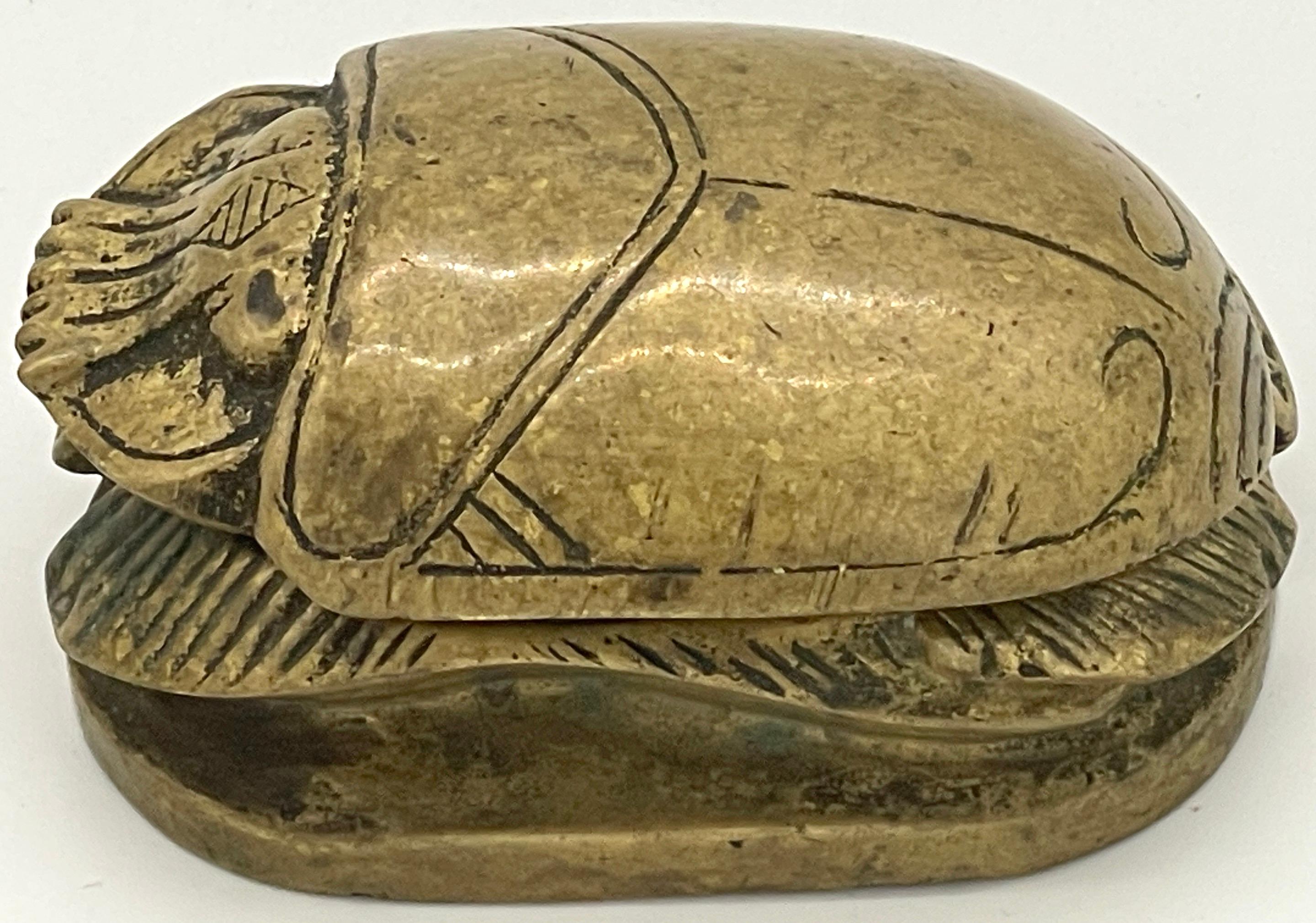 French Art Deco Egyptian Revival Bronze Scarab Box, with Hieroglyphs
France, circa 1930s

A captivating French Art Deco Egyptian Revival Bronze Scarab Box, made in France during the 1930s. This exquisite box draws inspiration from the ancient