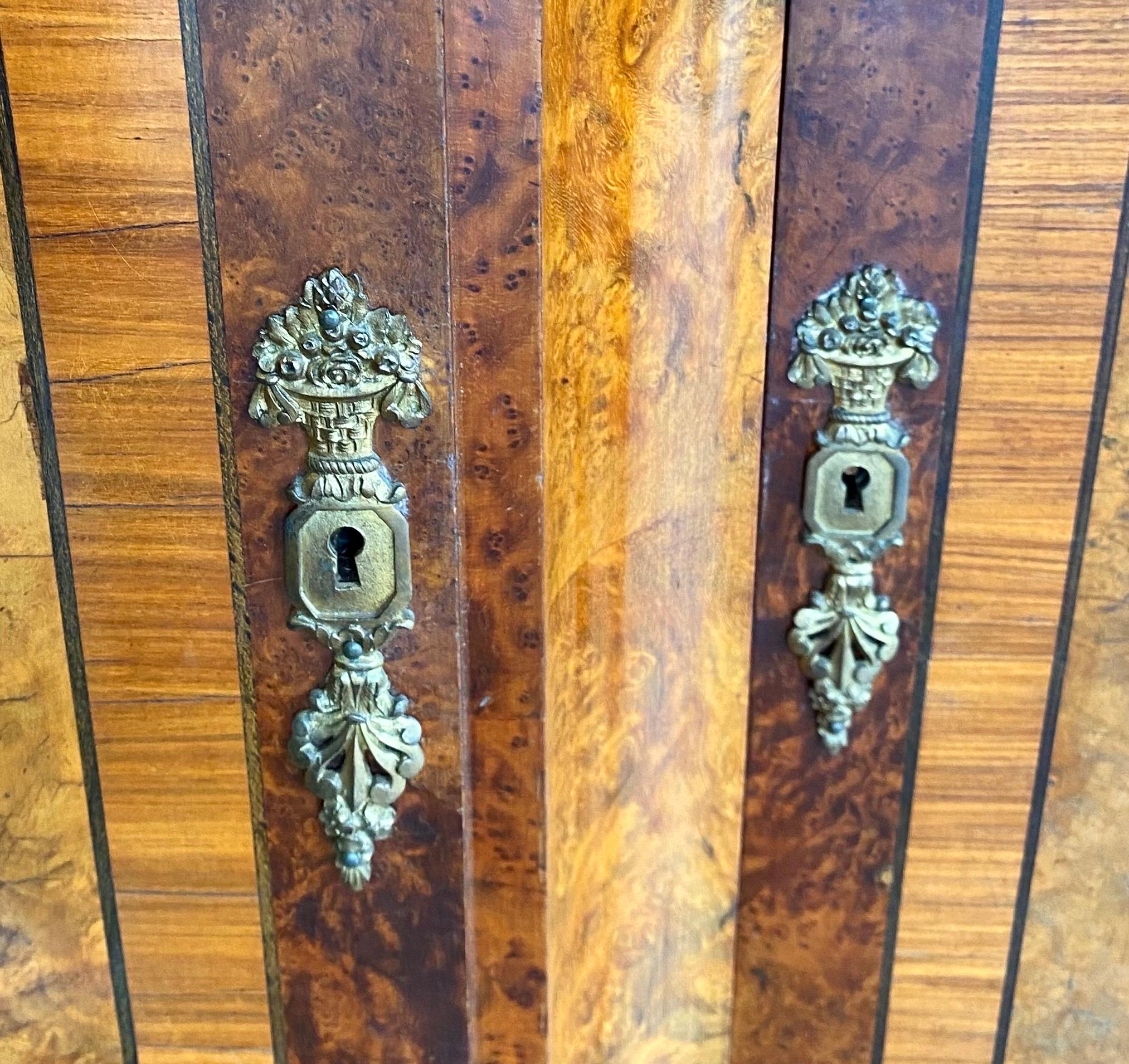 French Art Deco Eleven Piece Carved Inlaid Burled Walnut/Ormolu Dining Room In Good Condition For Sale In New Orleans, LA