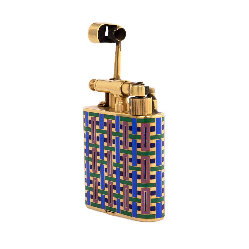An Art Deco gold hammer lighter with a woven geometric pattern of blue, pink and green enamel, in 18k. France