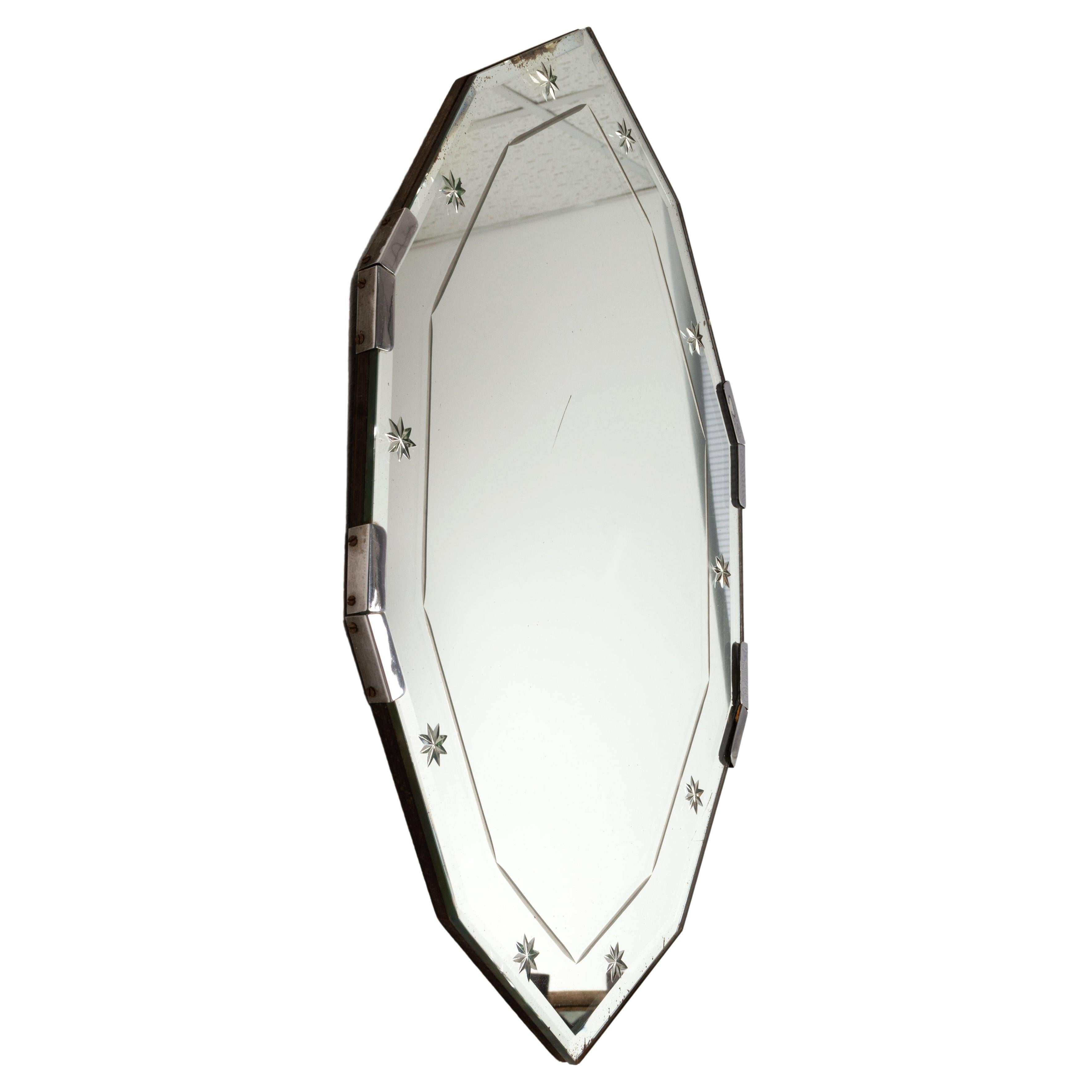 French Art Deco Etched Star Cut Glass Mirror C.1930

A charming mirror, of unusual form.

In very good condition, with very light foxing to the original mercury glass (around the edges, and a small line in the centre) please see photo.