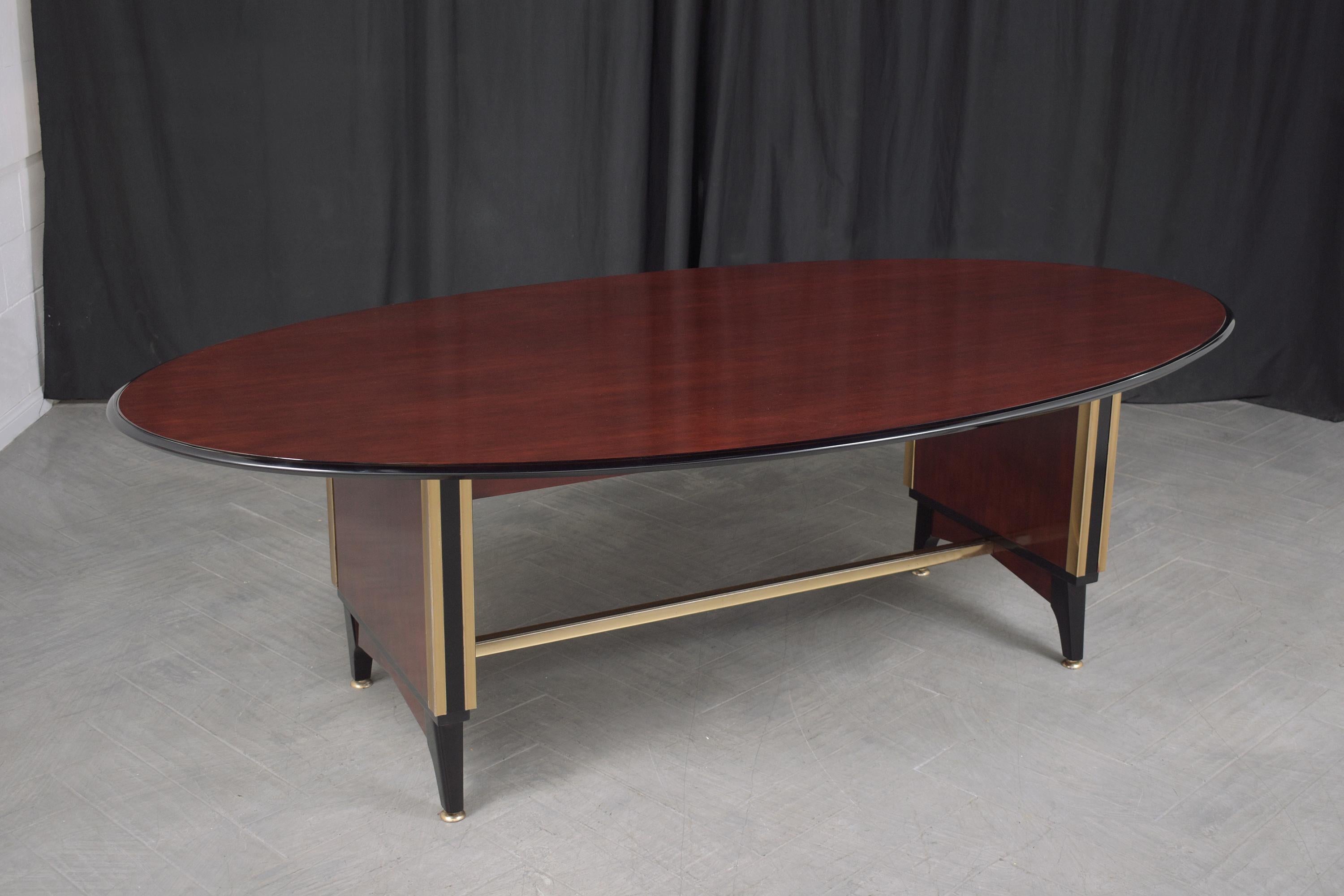 Elevate your work setting with the sheer sophistication of our 1950s French executive desk. A true masterpiece, handcrafted from the finest mahogany, this desk stands as a testament to the impeccable craftsmanship of the bygone era. Freshly restored
