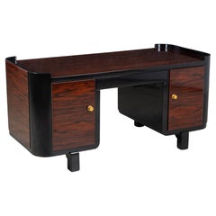 Französischer Art-Deco-Schreibtisch aus hochglänzendem Makassar-Ebenholz und Messing