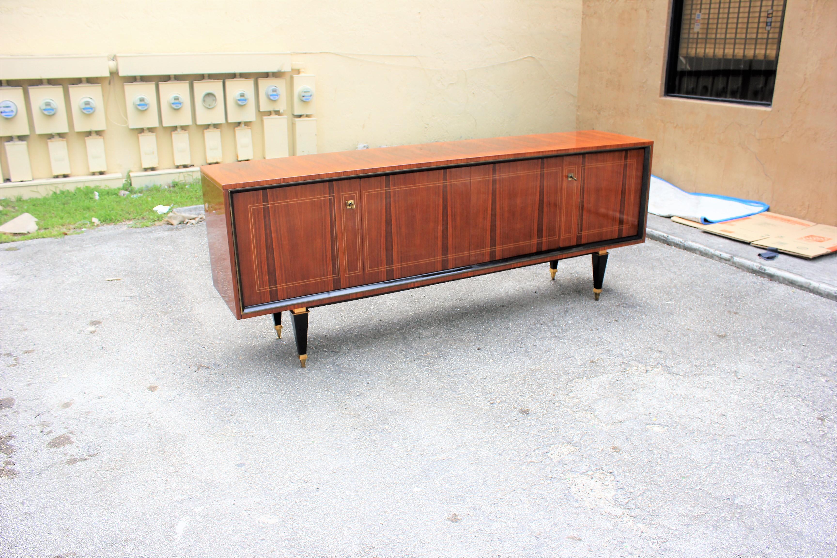 Beautiful French Art Deco exotic Macassar ebony sideboard, buffet or bar, circa 1940s. the sideboard are in very good condition, with three drawers inside, with two shelves adjustable, and bar section, you can remove all the shelves if you need more