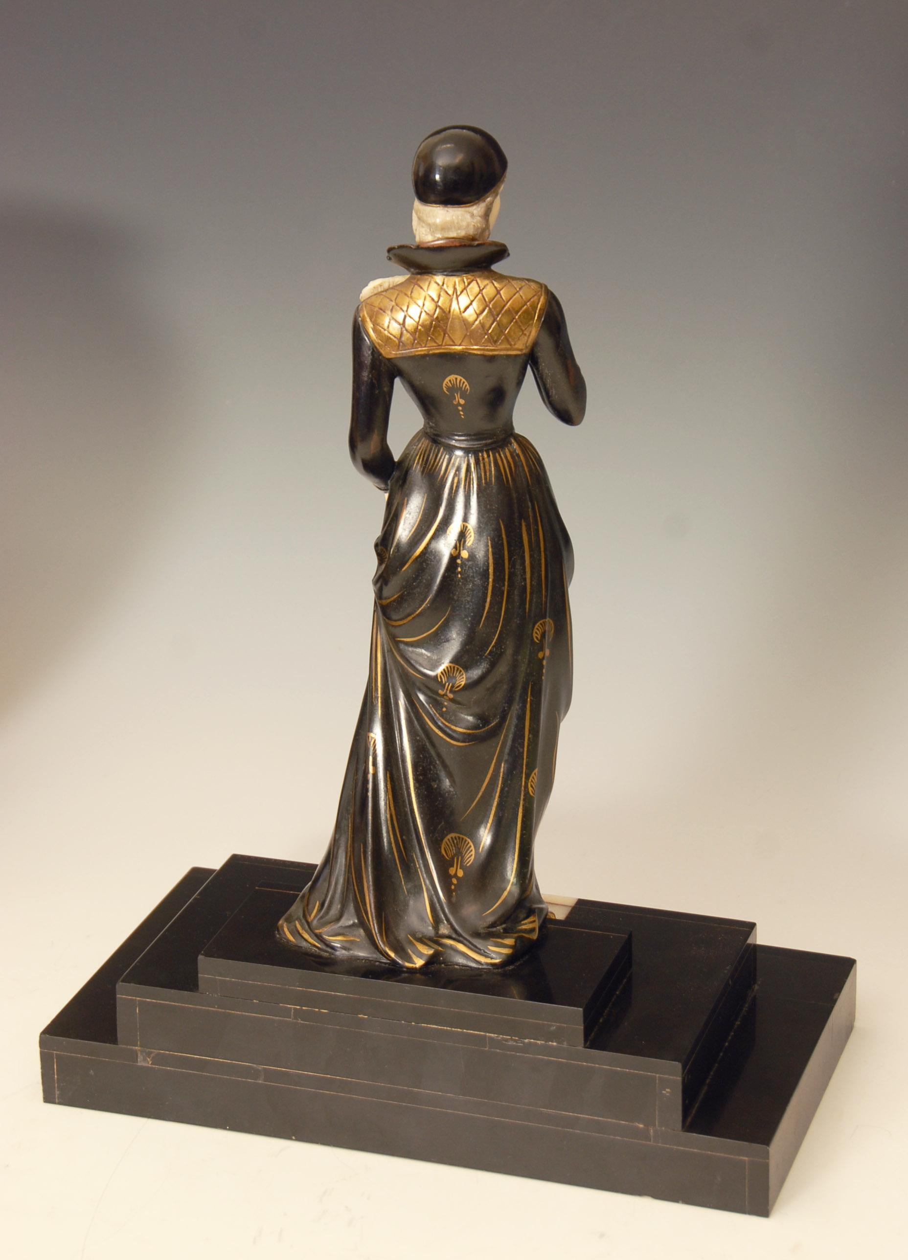Spelter French Art Deco Figure of a Lady Descending a Marble Staircase by E. Mennevile For Sale