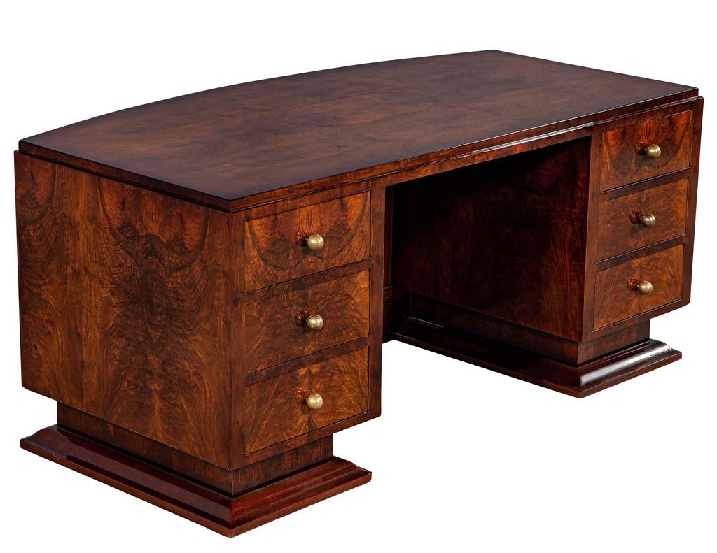French Art Deco flame walnut executive desk with chair. Unique bookmatched crotch walnut. This desk has the most stunning wood polished to a rich deep high gloss, complemented with the original solid brass ball style hardware and curved front