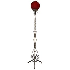 French Art Deco Floor Lamp in Wrought Iron and Red Glass Shade, circa 1940