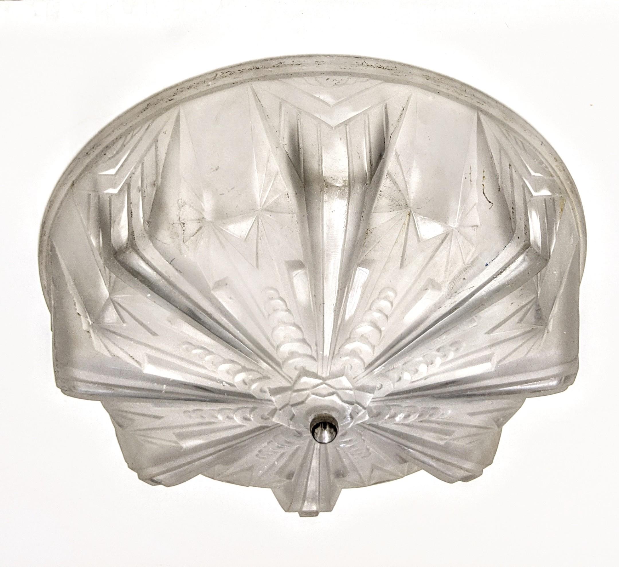 A French Art Deco flush mount was created by the French artist 