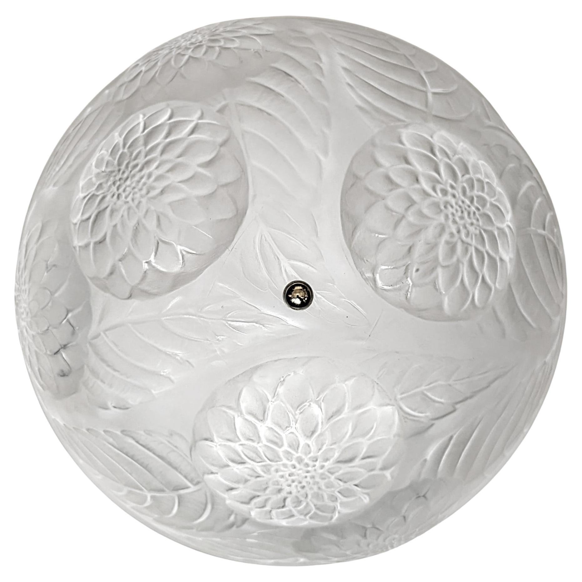 French Art Deco Flush Mount by René Lalique model Dahlias was designed in 1921 in great condition. Hemispherical clear coupe decorated in relief with dahlia blossoms and leaves. Coupe marked on the inside: R.Lalique. Rewired to U.S standards. It can