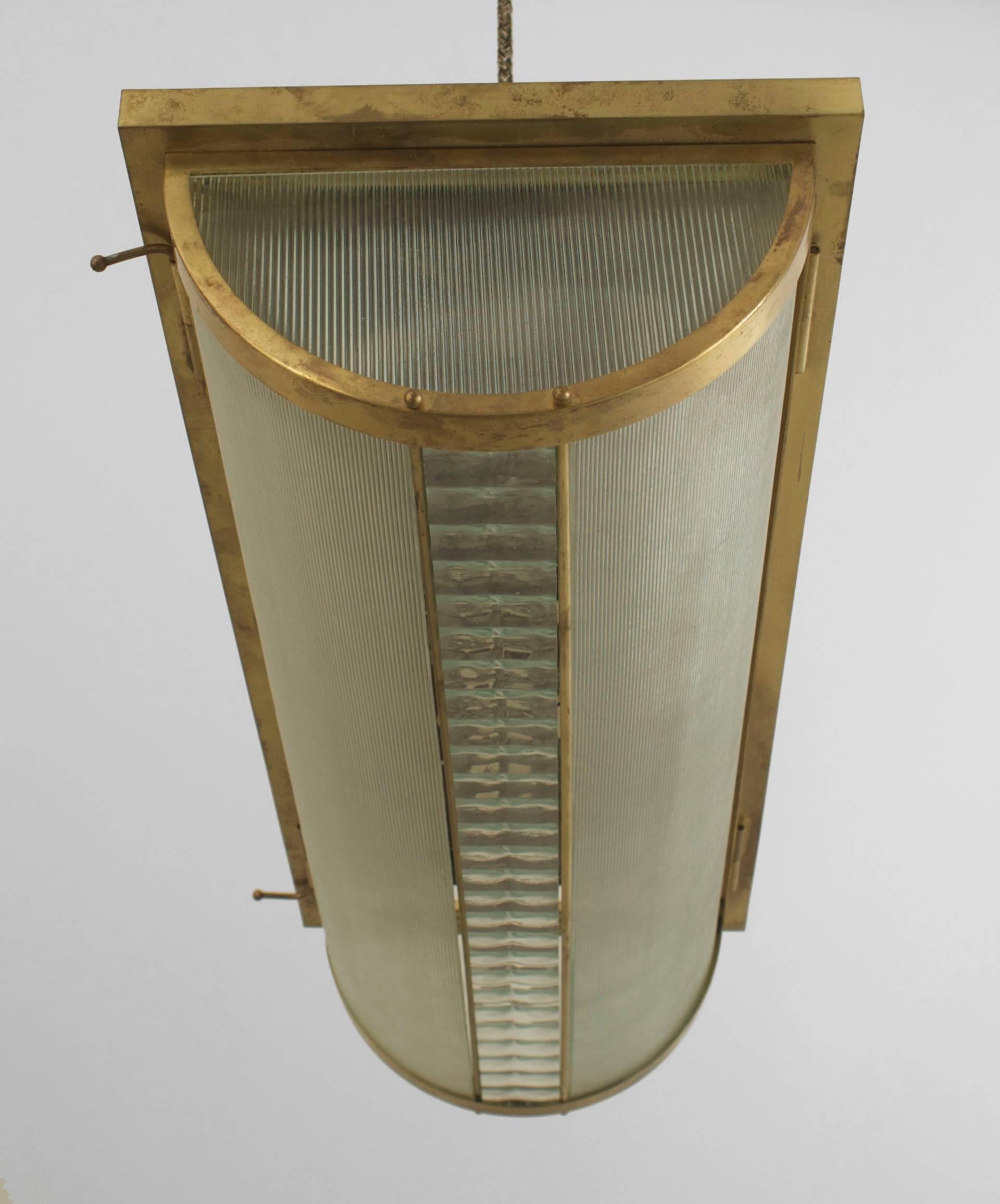 French Art Deco flush mounted brass framed ceiling fixture with horizontal frosted and fluted glass panels separated by a centred strip of faceted clear glass.

  