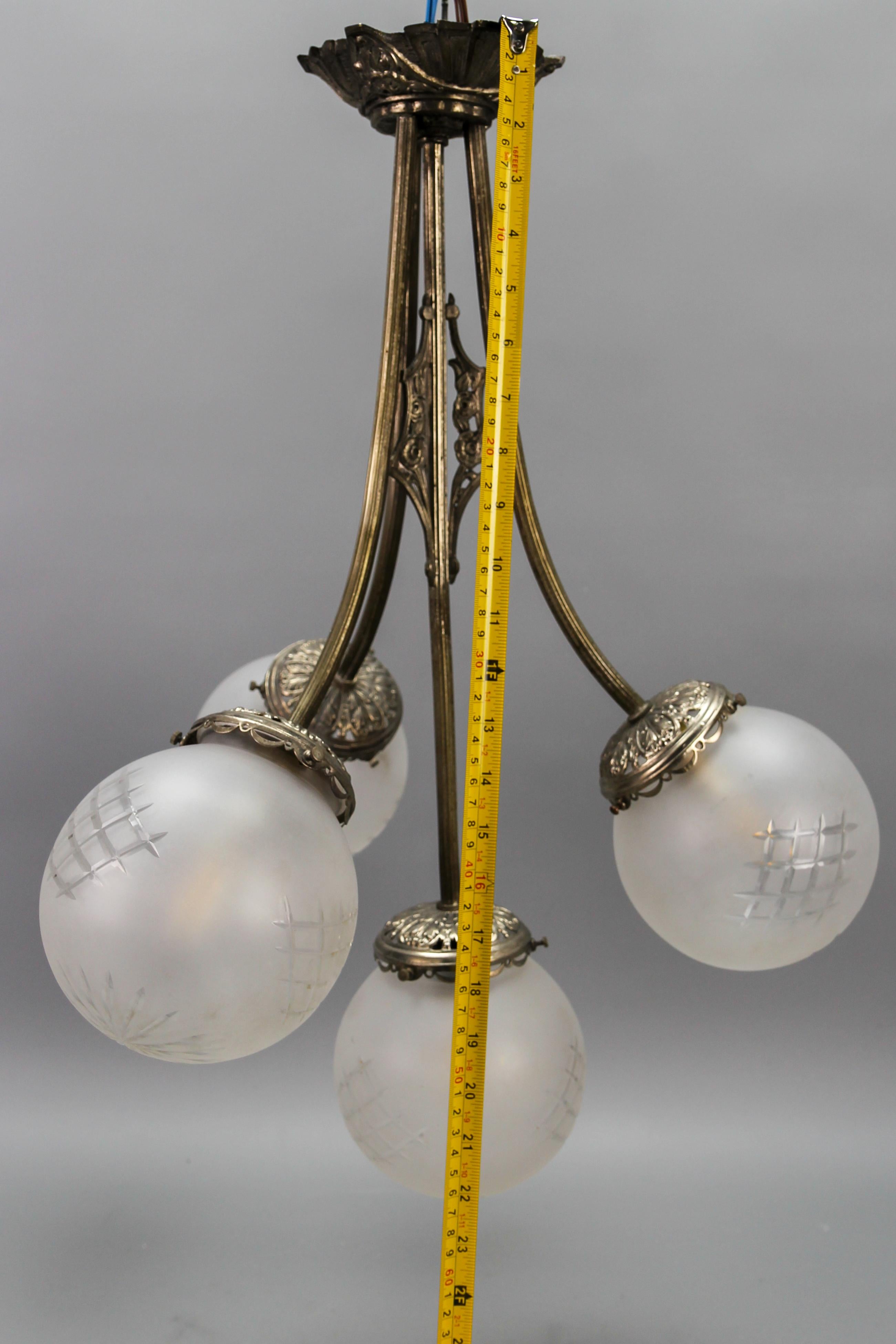 French Art Deco Four-Light Brass and Frosted Cut Glass Globes Pendant Chandelier For Sale 10