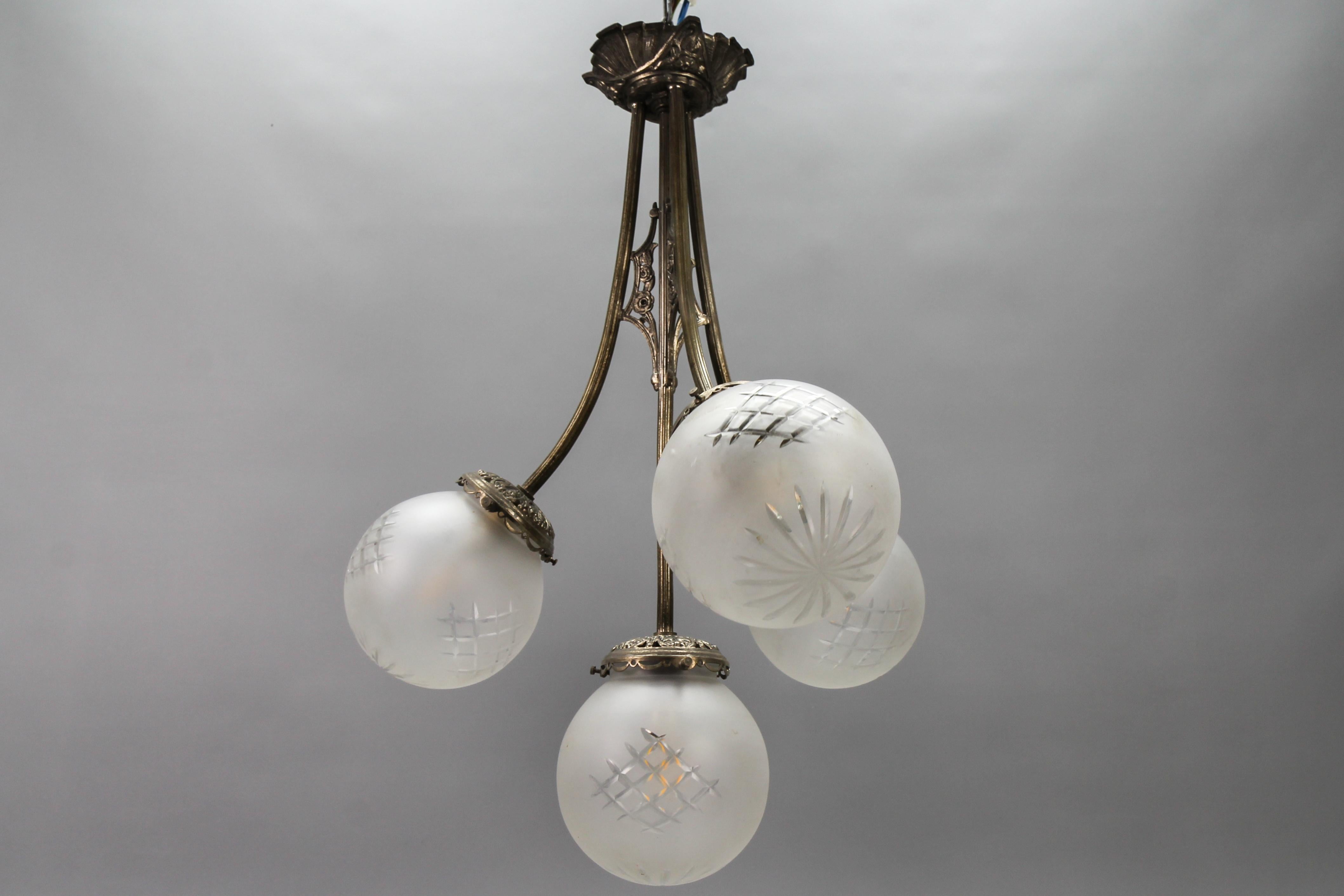 French Art Deco Four-Light Brass and Frosted Cut Glass Globes Pendant Chandelier For Sale 1