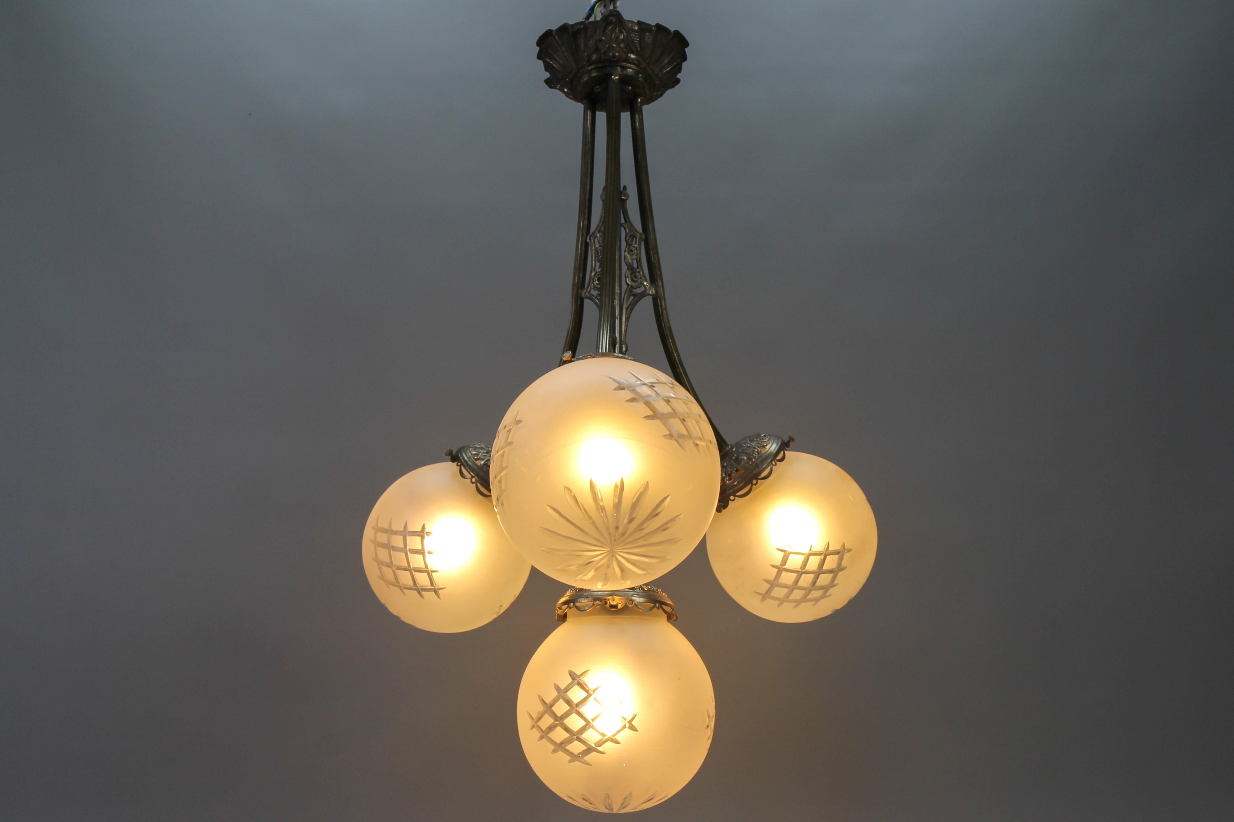 French Art Deco Four-Light Brass and Frosted Cut Glass Globes Pendant Chandelier For Sale 3