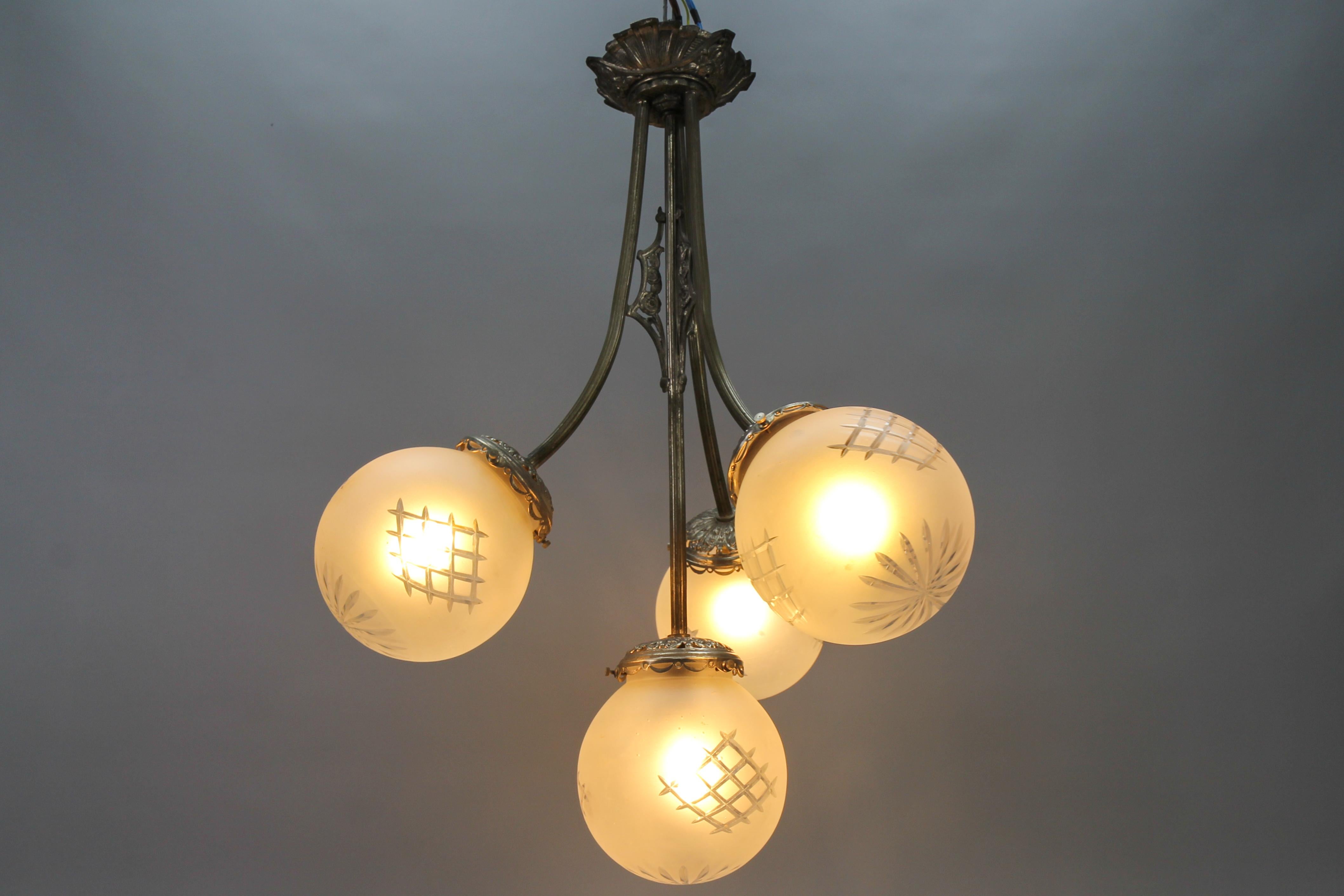 French Art Deco Four-Light Brass and Frosted Cut Glass Globes Pendant Chandelier For Sale 4