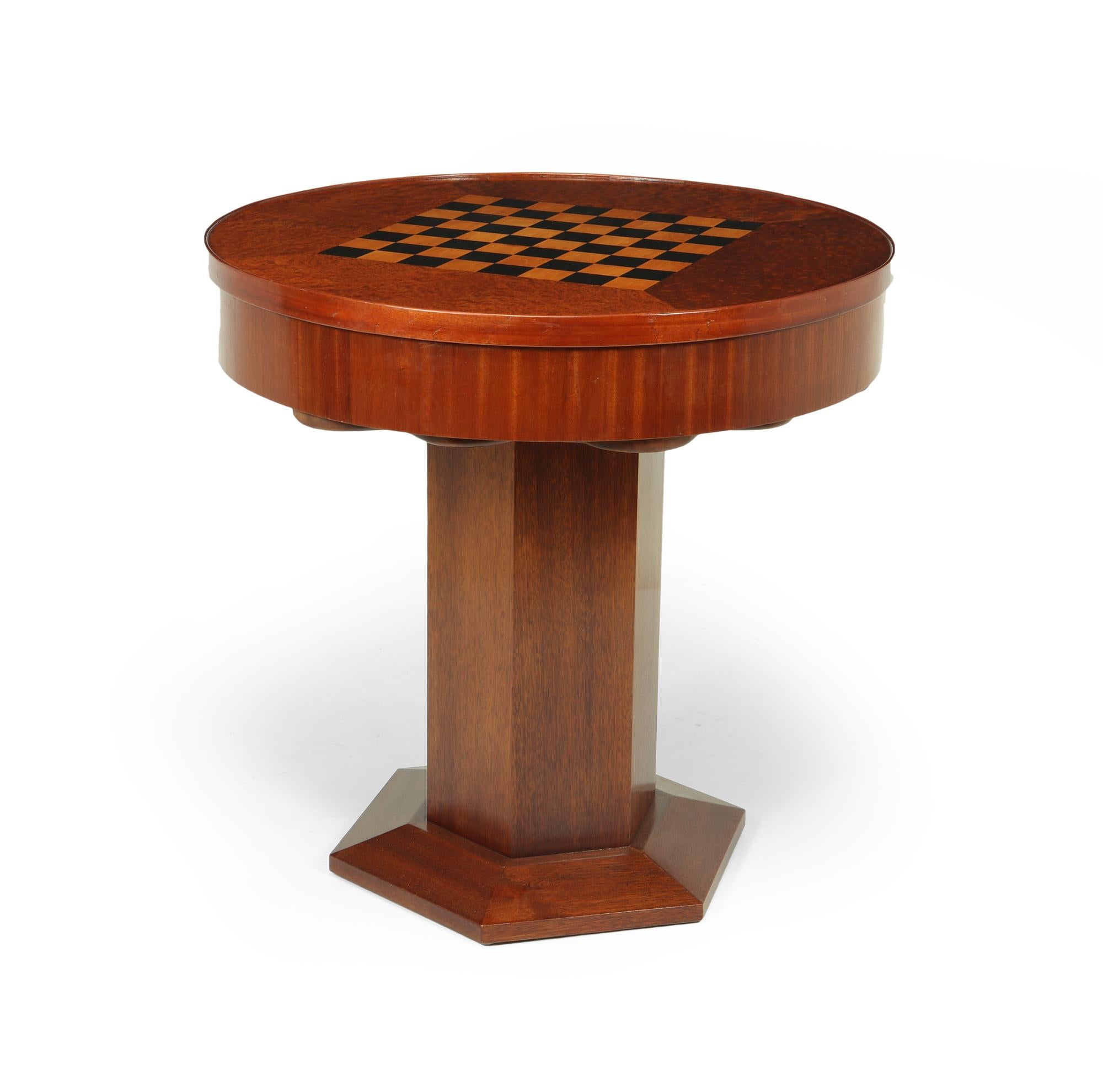 French Art Deco games table c1920

A very rare and unusual games table with mahogany base and amboyna flip over top ebony and boxwood chessboard with flip over top to reveal baize felt lined card table, under this is what I believe to be a marble