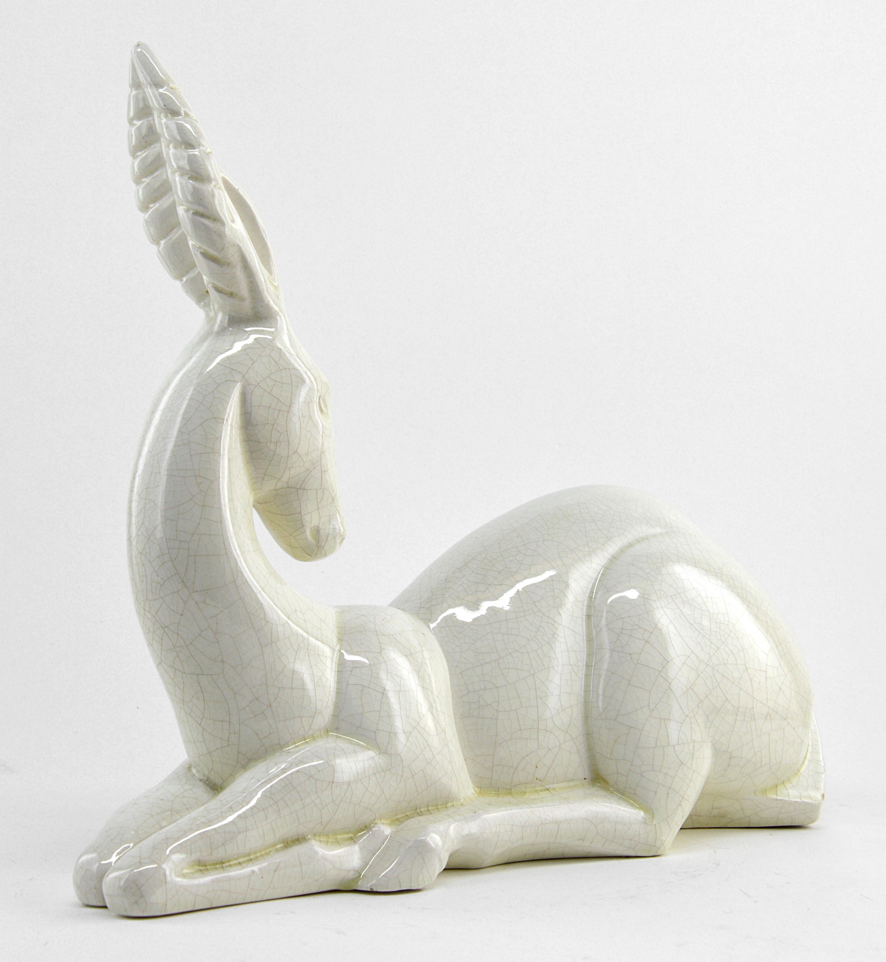 French Art Deco Gazelle (antelope) by Charles Lemanceau at Saint-Clement, France, 1930. Crackle glaze ceramic. Sold by Les Galeries Lafayette, number #7 on the 1930 Saint-Clement catalog. Illustrated in 