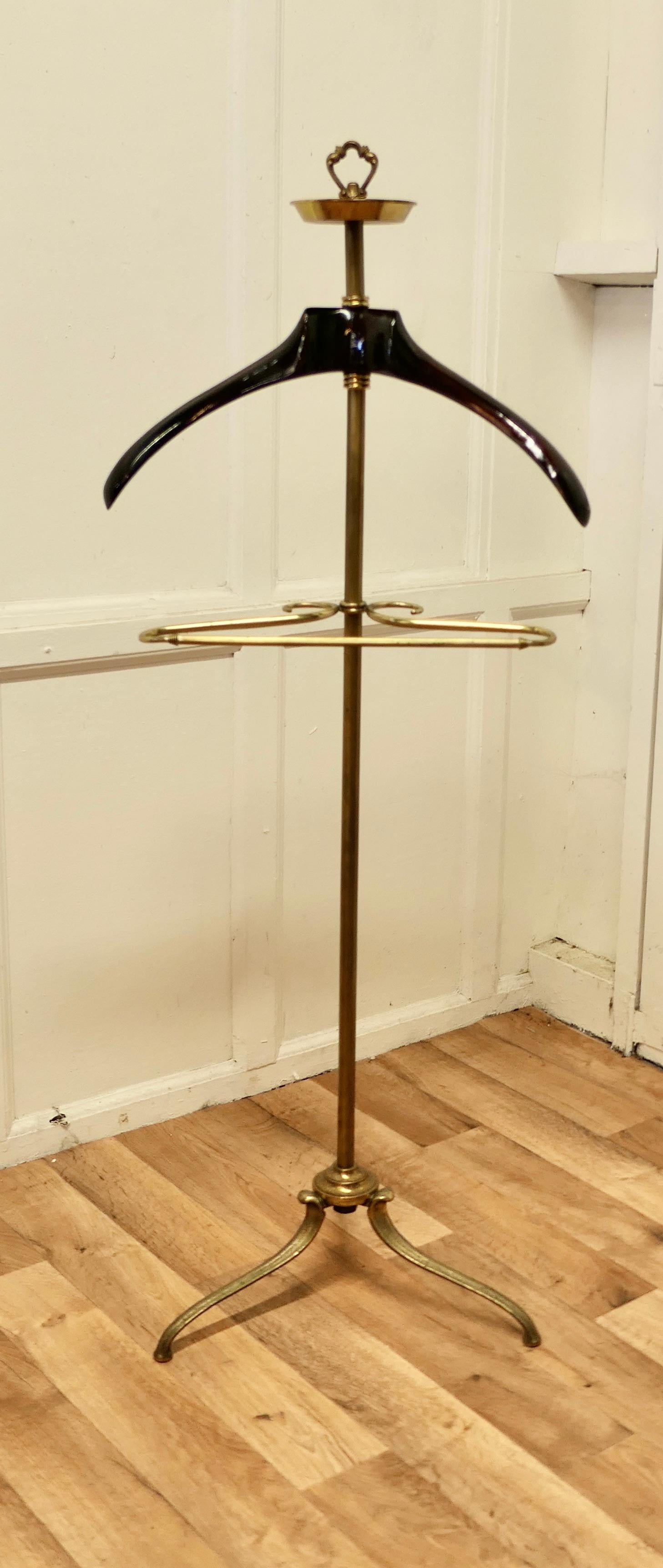 French Art Deco Gentleman’s floor standing brass suit hanger or dumb valet 


A very useful piece, the hanger or clothes stand is in brass and has a 3 footed base, it has a small circular tray at the top for cufflinks etc. and a central brass rail