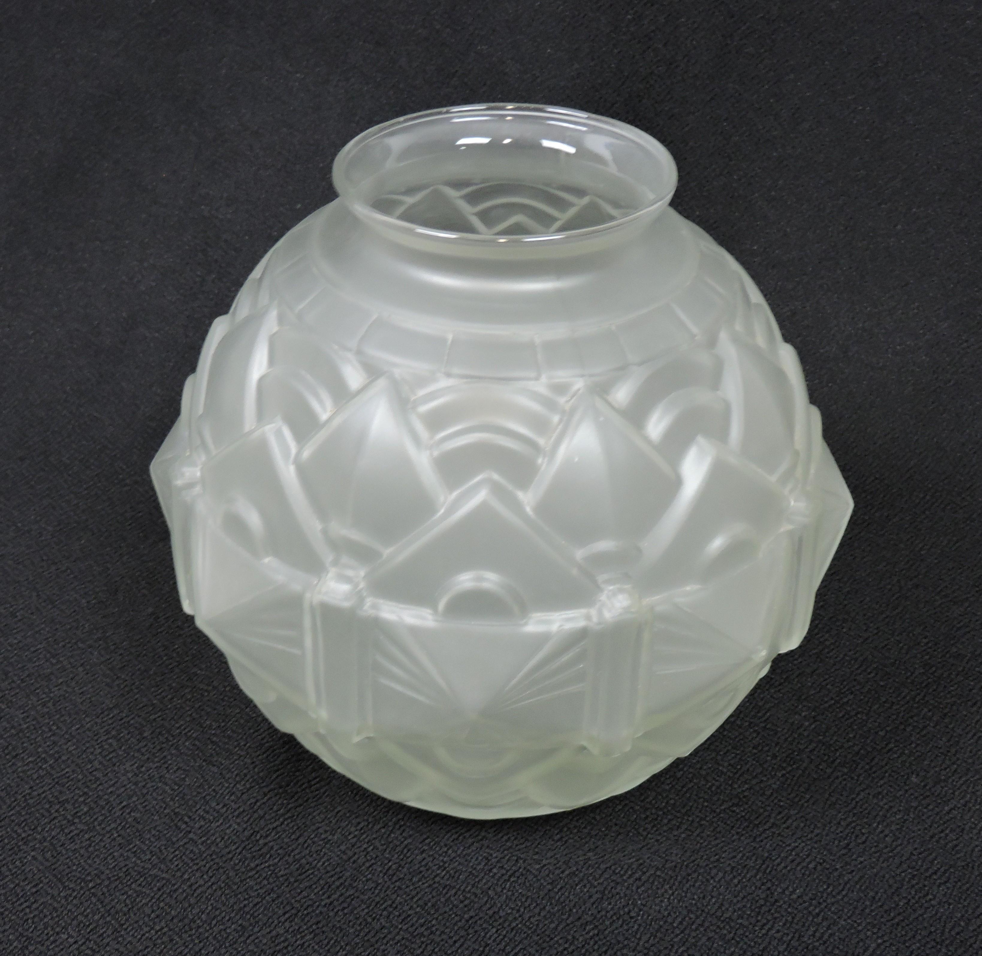 Beautiful French Art Deco mold blown glass vase. This vase has a ball shape with a wonderful geometric relief design and a smooth, acid frosted finish on clear glass.