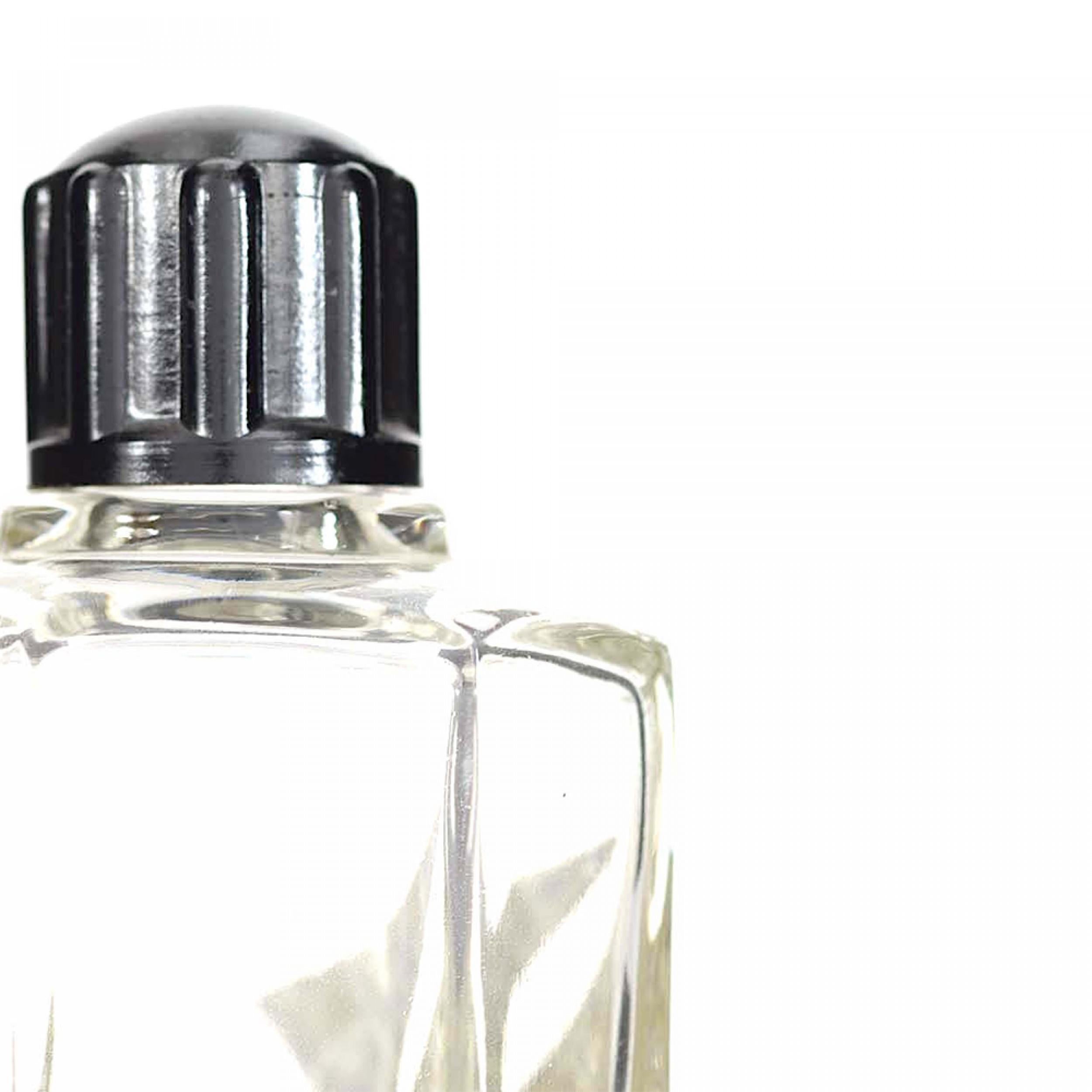 Flacone di profumo francese in vetro trasparente sfaccettato Art Deco con disegno geometrico smaltato in verde e argento e tappo a vite in plastica nera. (2 PREZZI CIASCUNO)