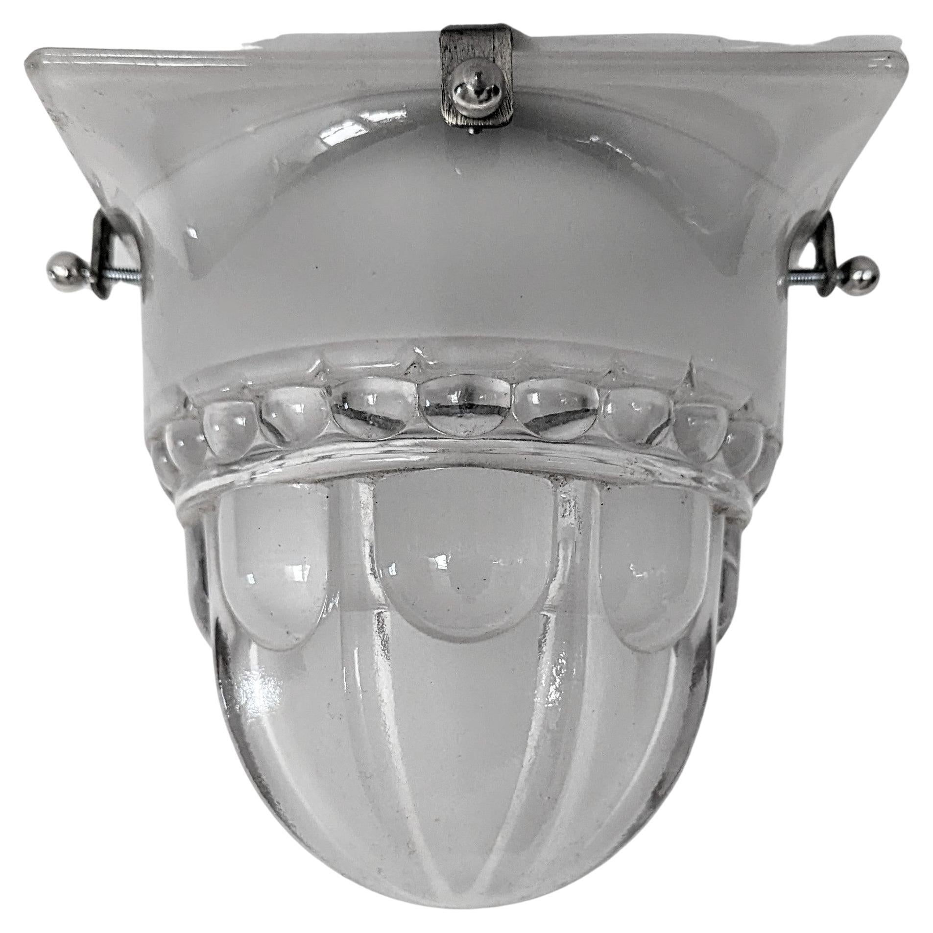 A French Art Deco square shaped flush mount or can be used as sconces. The shade is decorated with a typical deco motif in clear frosted glass in great condition, mounted on a frameless design nickeled frame. The fixture has been re-plated in nickel