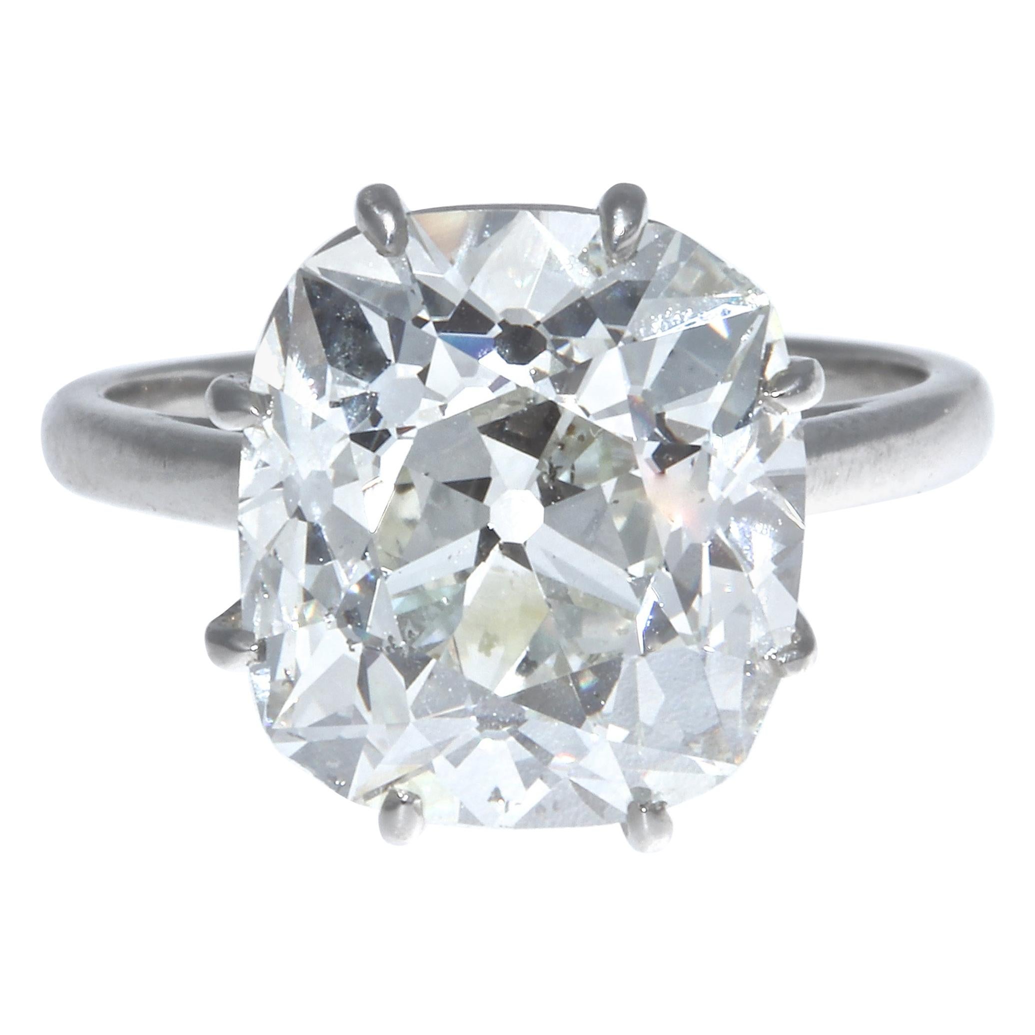 Simply put, this is The Perfect engagement ring. An incredibly fiery and brilliant 6.33 carat GIA certified old mine brilliant cut diamond steals hearts while providing more than ample finger coverage. This GIA certified old mine brilliant cut