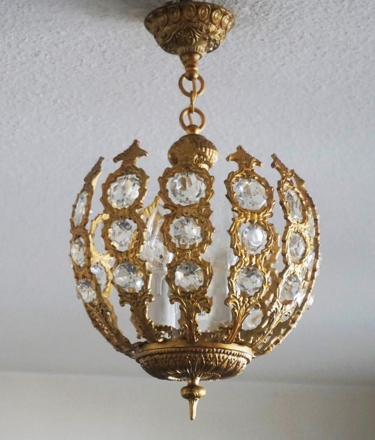 A lovely Art Deco gilt bronze and crystal ball shape four-light chandelier or lantern, France, 1930-1939.
Four candelabra E14 light bulb sockets.
Measures:
Height 19