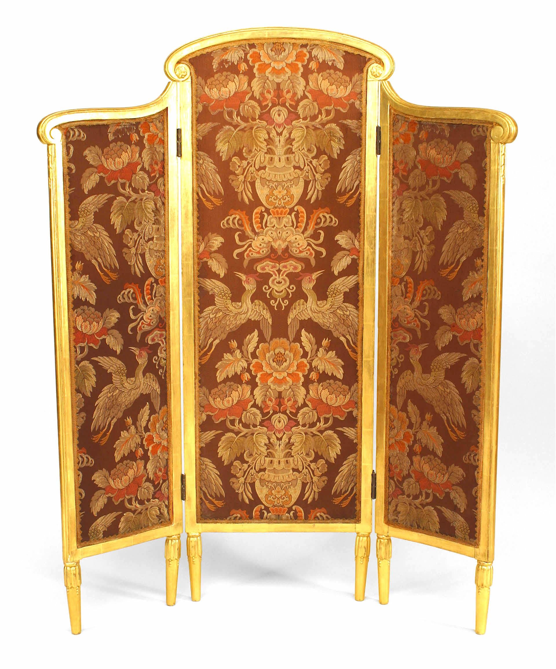 French Art Deco low 3 fold gilt screen with arch form center and upholstered panels in maroon with floral & bird design (attributed to SUE & MARE)
