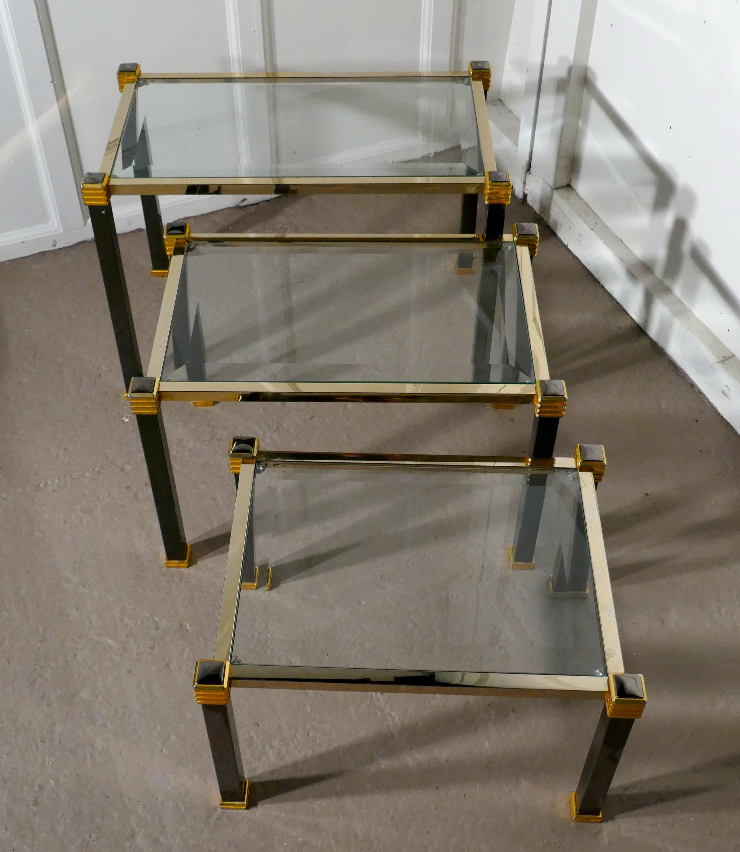 French Art Deco Glass and Brass Nest of Tables

This is a very stylish good-looking set of tables, they have bevelled glass table tops set on Black and Brass coloured metal frames
The tables are sound and in good condition, as with all Nests of