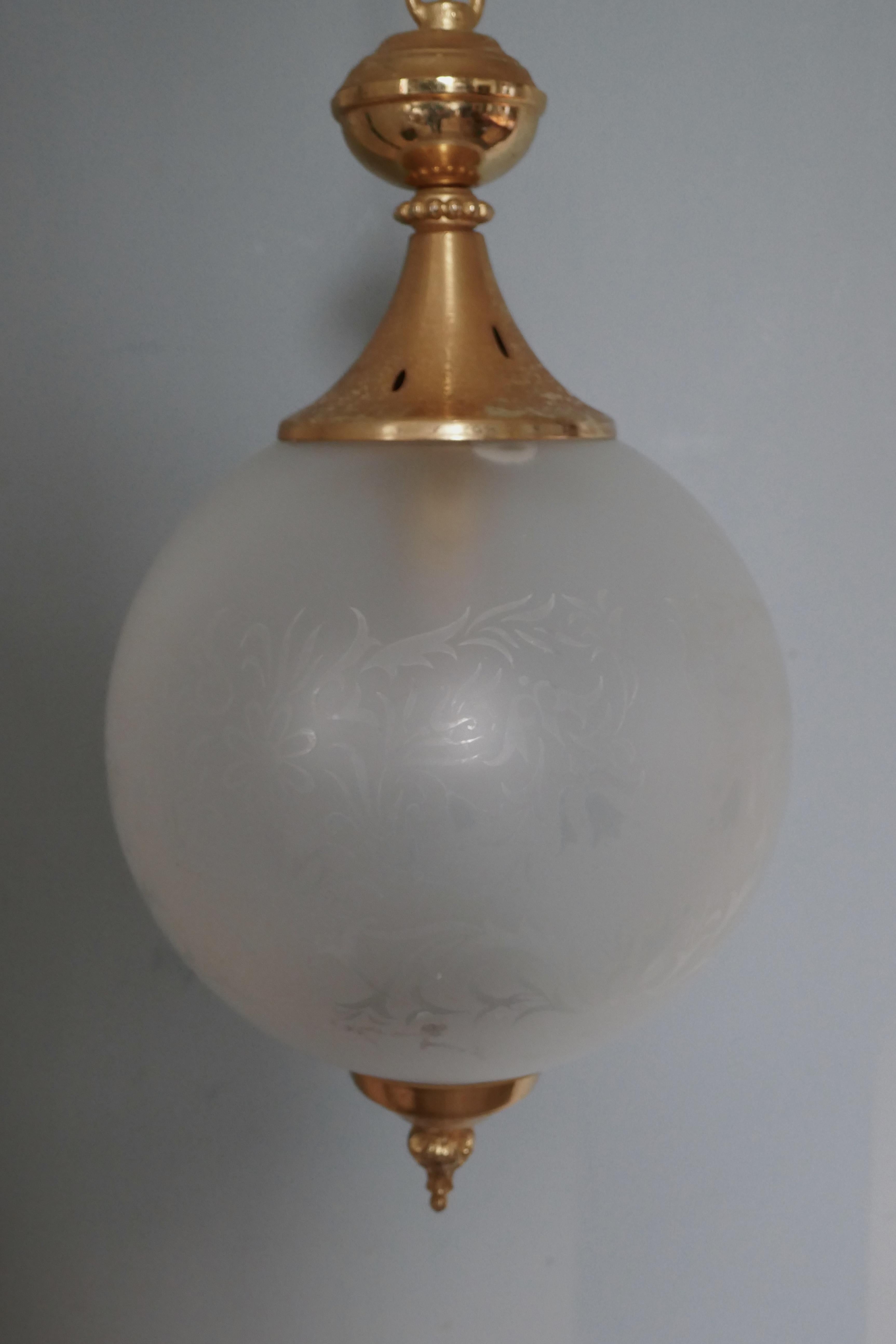 French Art Deco globe opaline glass hanging pendant light


Simple and beautiful, this lovely etched glass globe has brass mounts, rose and chain
The light is in very good condition, the wiring is recent, it comes from France, it is 23” long and