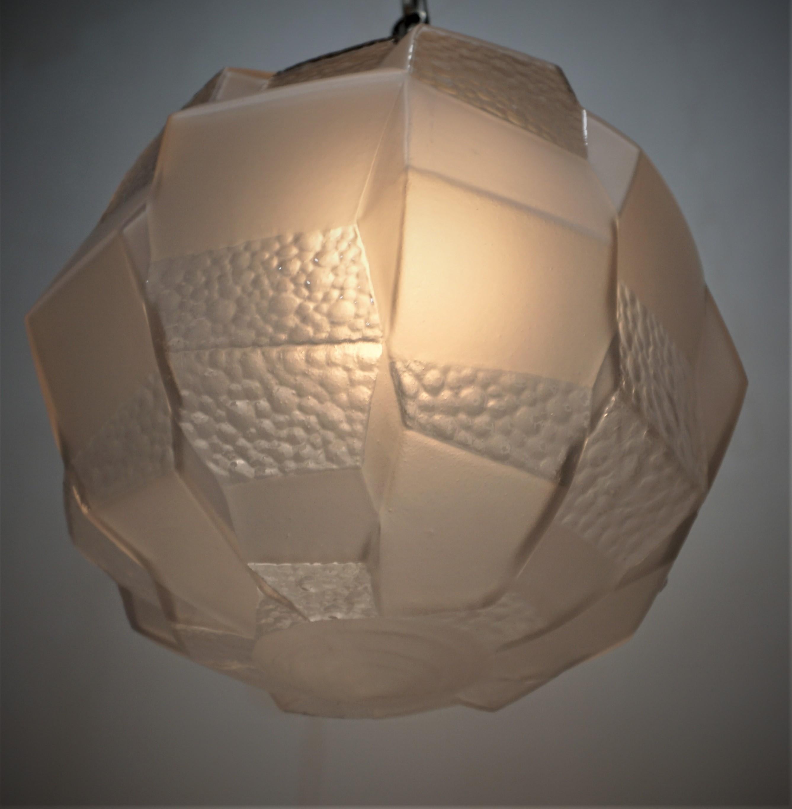 Beautiful clear texture and frost geometric glass globe pendent chandelier with nickel on bronze hardware.