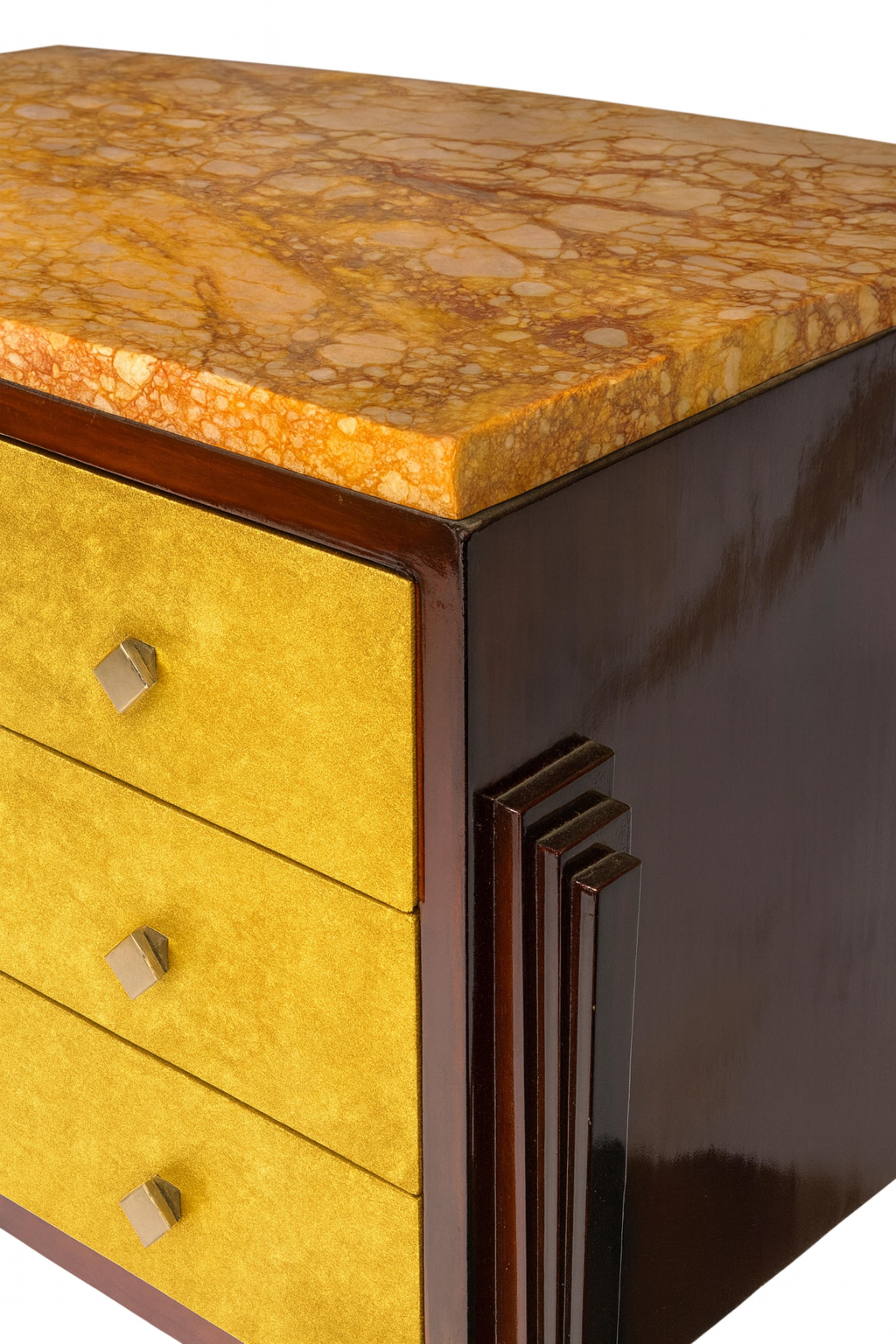 A three-drawer commode featuring a sleek golden gilt finish and high-gloss varnish in walnut complemented by elegant metal hardware. This sophisticated piece is crafted from rare red Verona marble, quarried in Verona, Italy, showcasing its luxurious